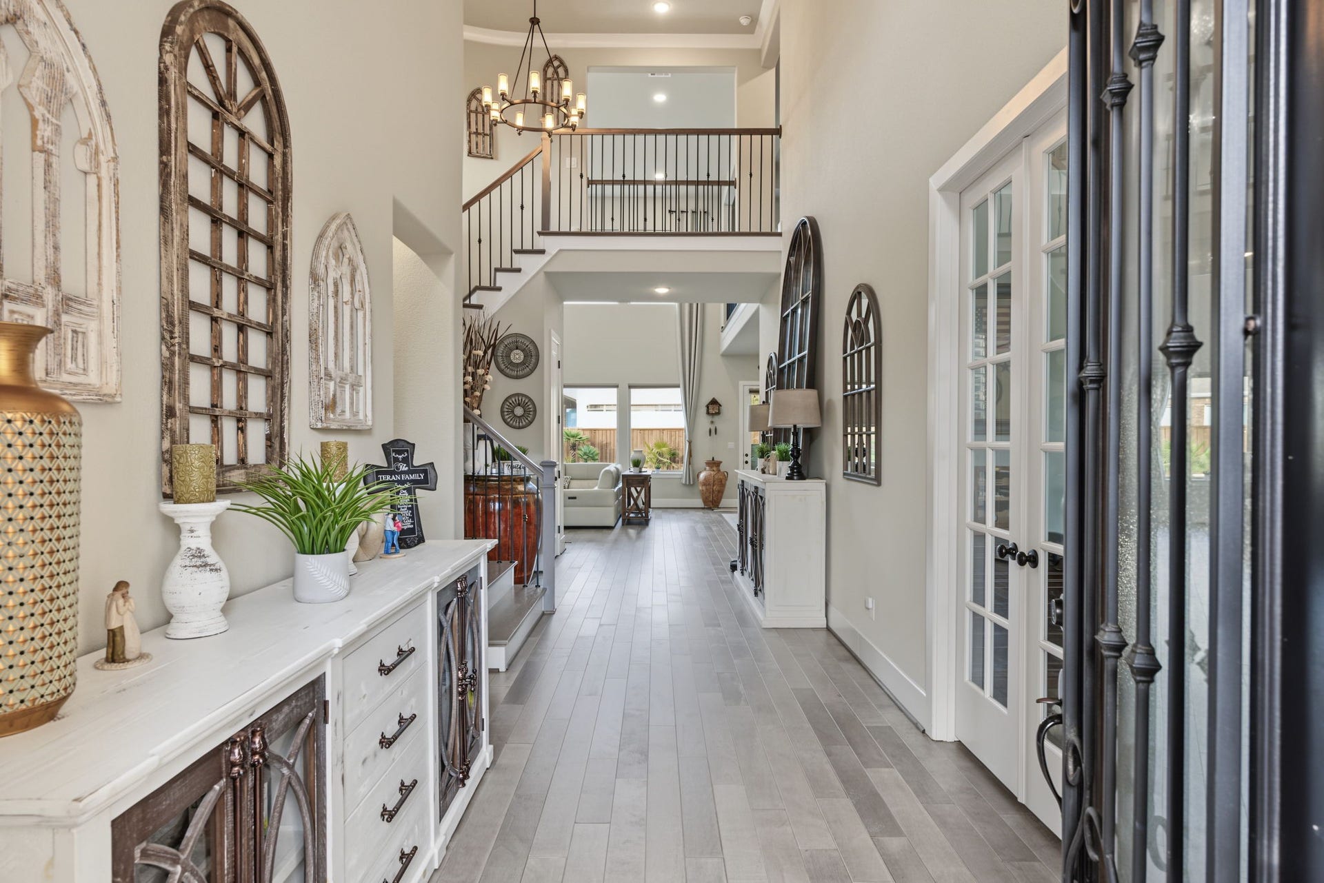 Welcome Home! Step inside to soaring ceilings, elegant architectural details, beautiful flooring, and a welcoming foyer.