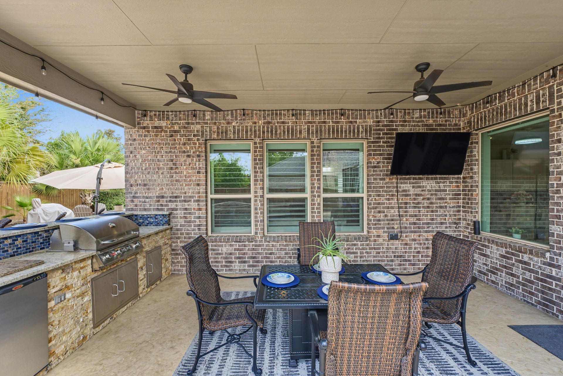 Enjoy outdoor living at its finest with an expansive paver patio, beautiful tropical landscaping, a sparkling pool, and a multiple spacious outdoor dining area, perfect for entertaining guests, hosting family gatherings, or simply relaxing in your private backyard retreat!