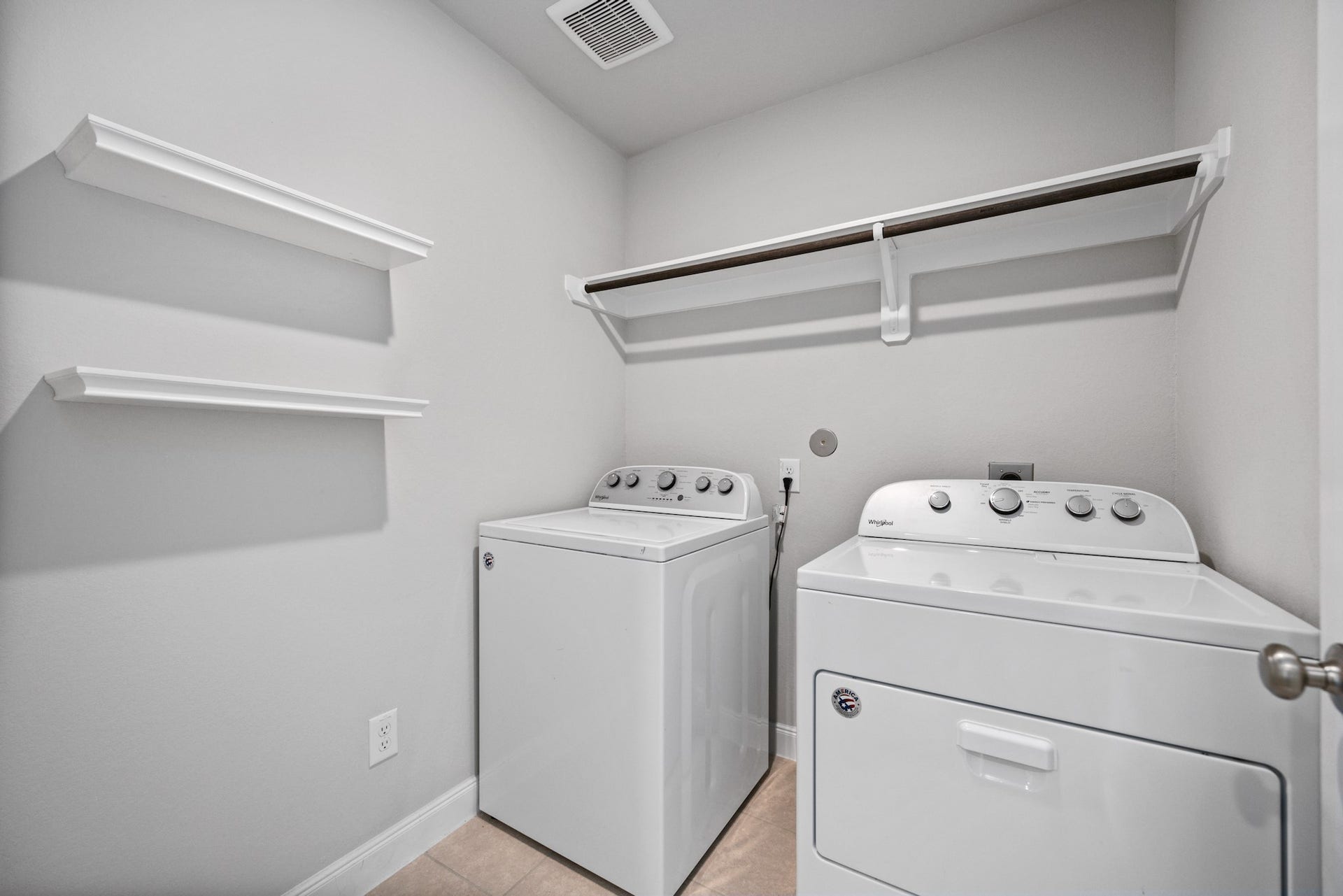 11403 Brookside Arbor Lane, Richmond, TX 77406 Life gets easy with this sizable laundry/utility room loaded with shelving, hanging space, and room for side-by-side washer and dryer..