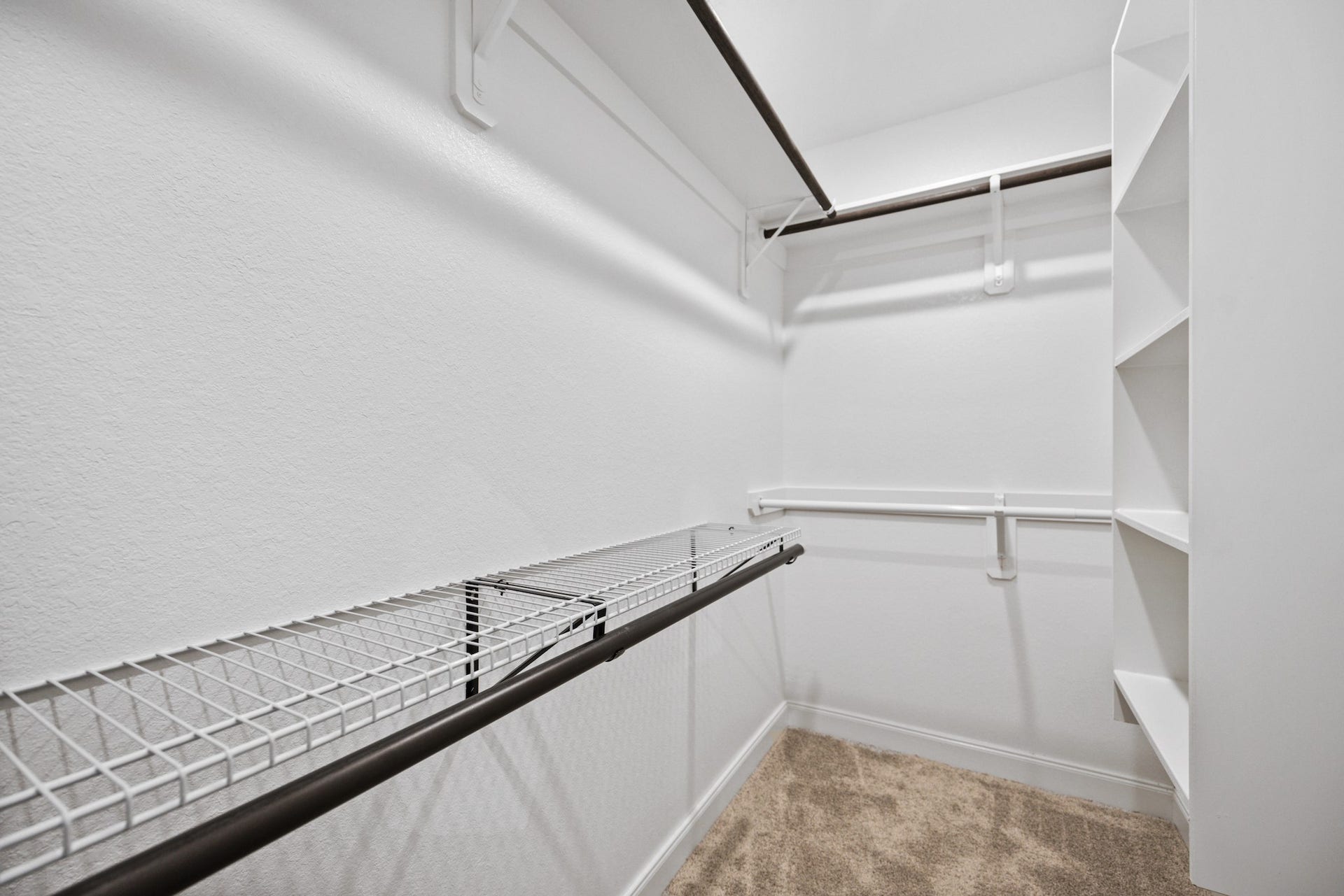 11403 Brookside Arbor Lane, Richmond, TX 77406 Dress up every day in this spacious walk-in closet boasting ample shelving and hanging space.