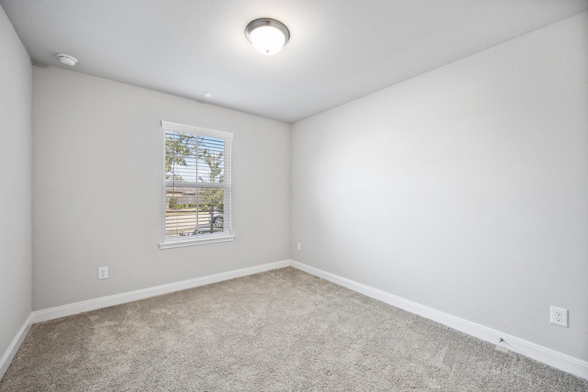 11403 Brookside Arbor Lane, Richmond, TX 77406 A cozy, plush-carpeted secondary bedroom at the front of your home, overlooking the front yard.