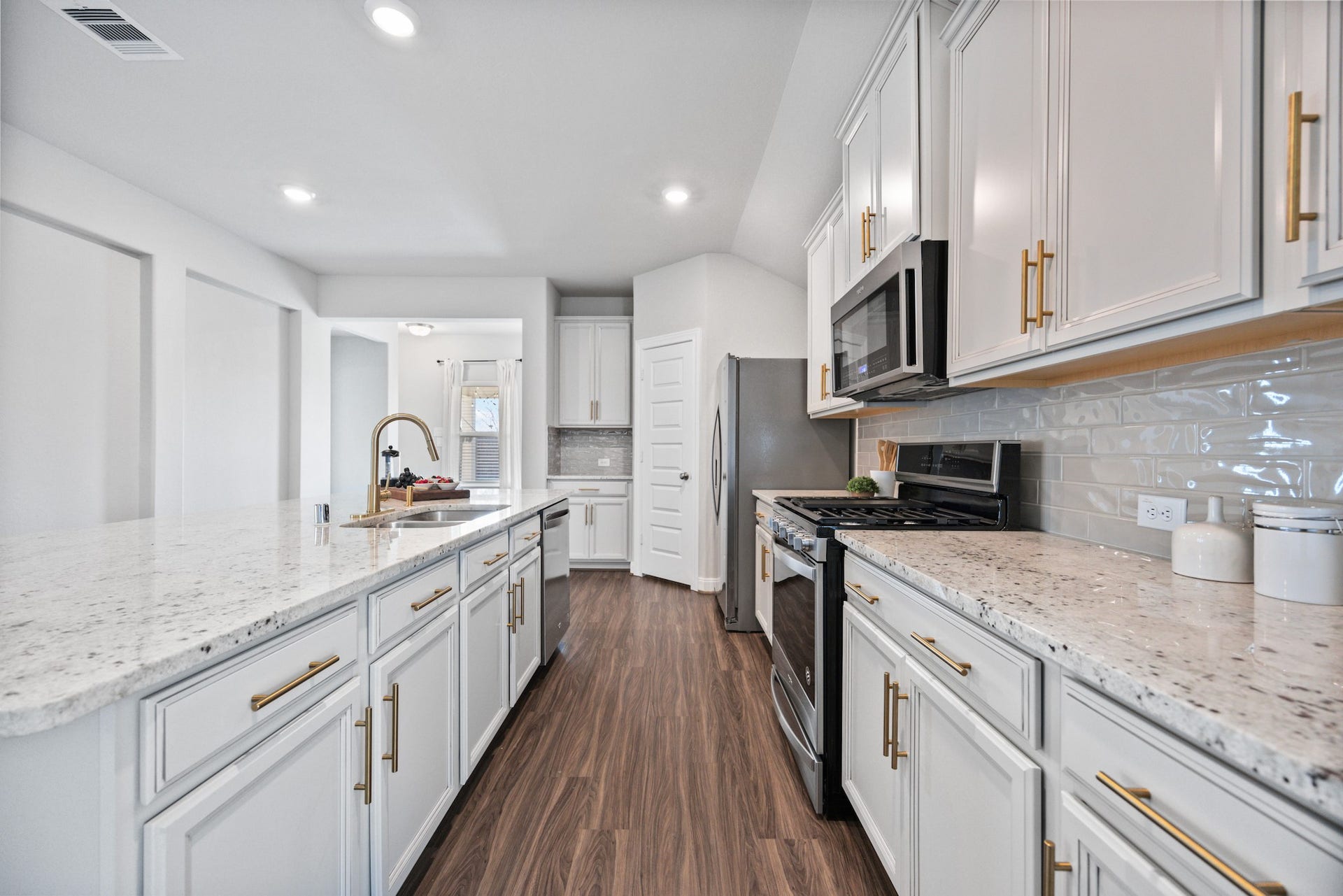 11403 Brookside Arbor Lane, Richmond, TX 77406 All the chef's delights a six-burner natural gas range, built-in microwave oven, roomy pantry. Refrigerator included!