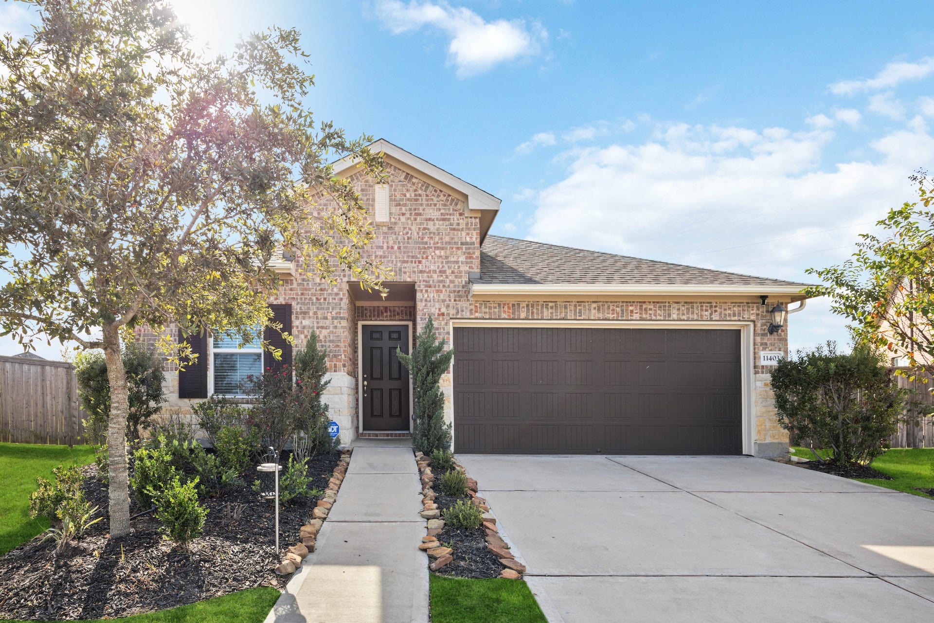 11403 Brookside Arbor Lane, Richmond, TX 77406 Welcome to your soon-to-be home, built by Meritage, complete with a beautiful brick front facade, double-wide driveway, two-car attached garage, and welcoming landscape.
