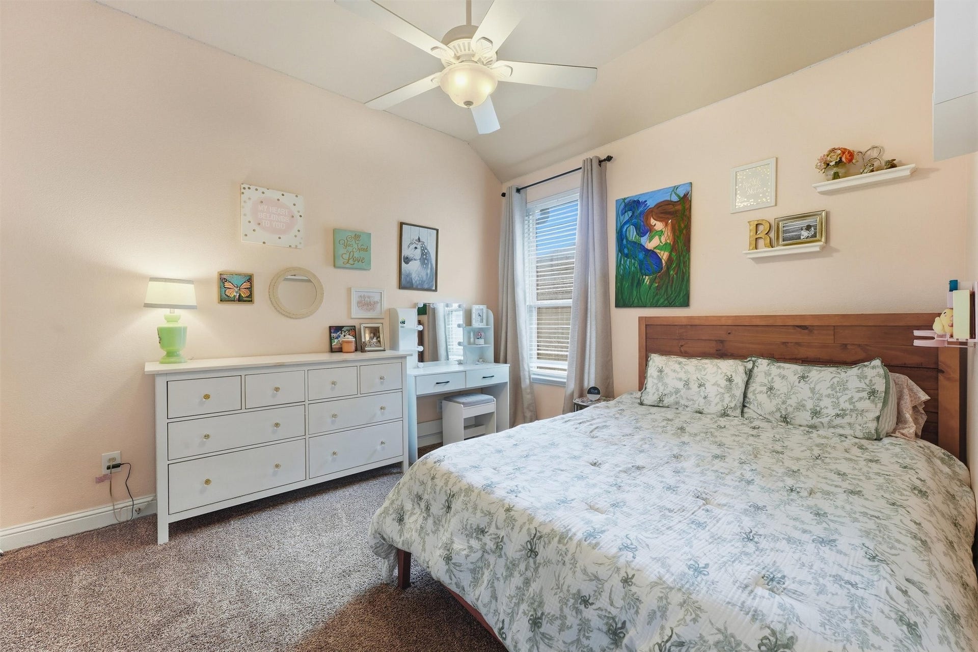 1413 Silver Rings Court, Pearland, TX 77581 Natural light streams in through a large window, enhancing the bedroom's warm and inviting atmosphere.