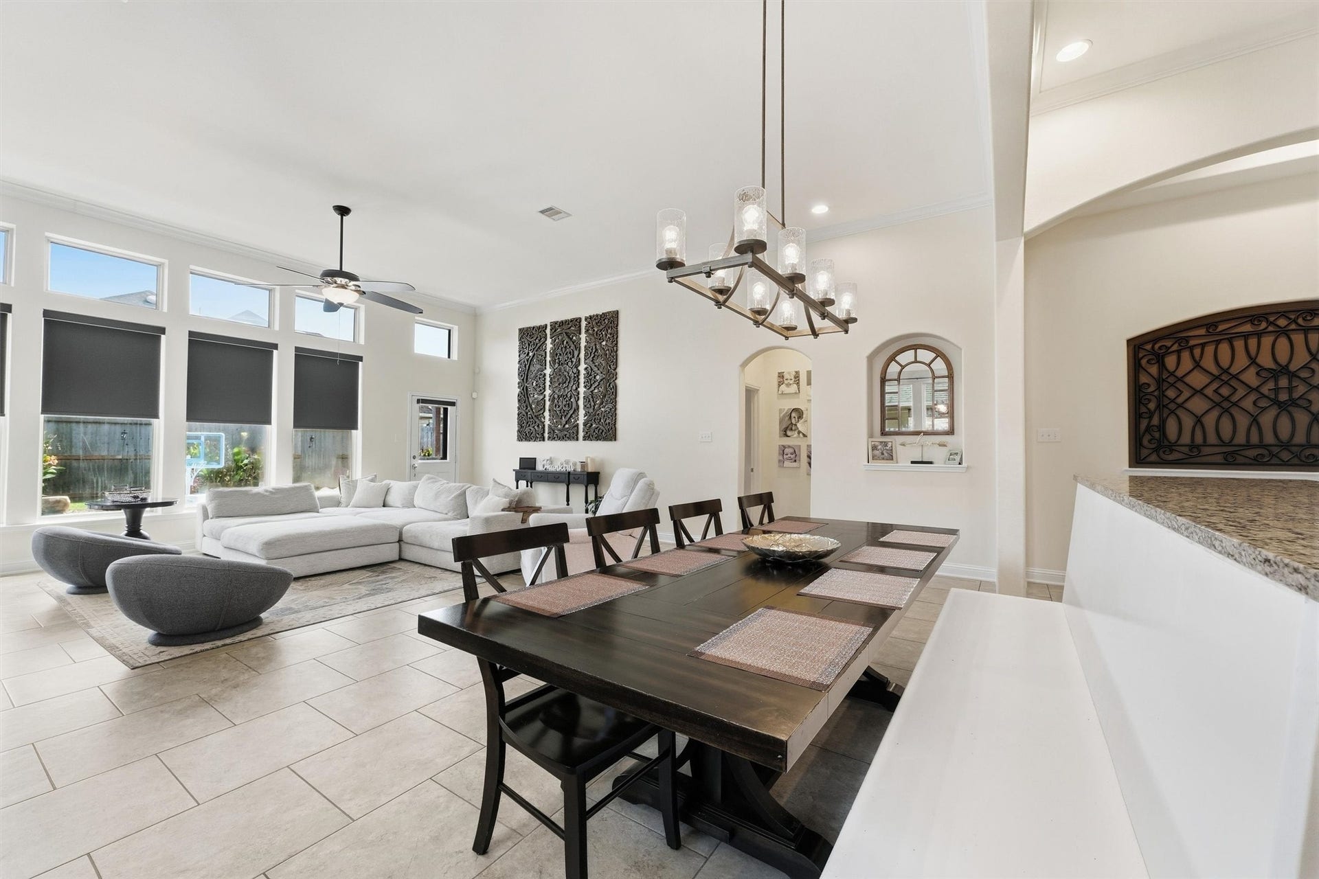 1413 Silver Rings Court, Pearland, TX 77581 Spacious open-concept living and dining area with high ceilings, abundant natural light from large windows, and elegant modern finishes.