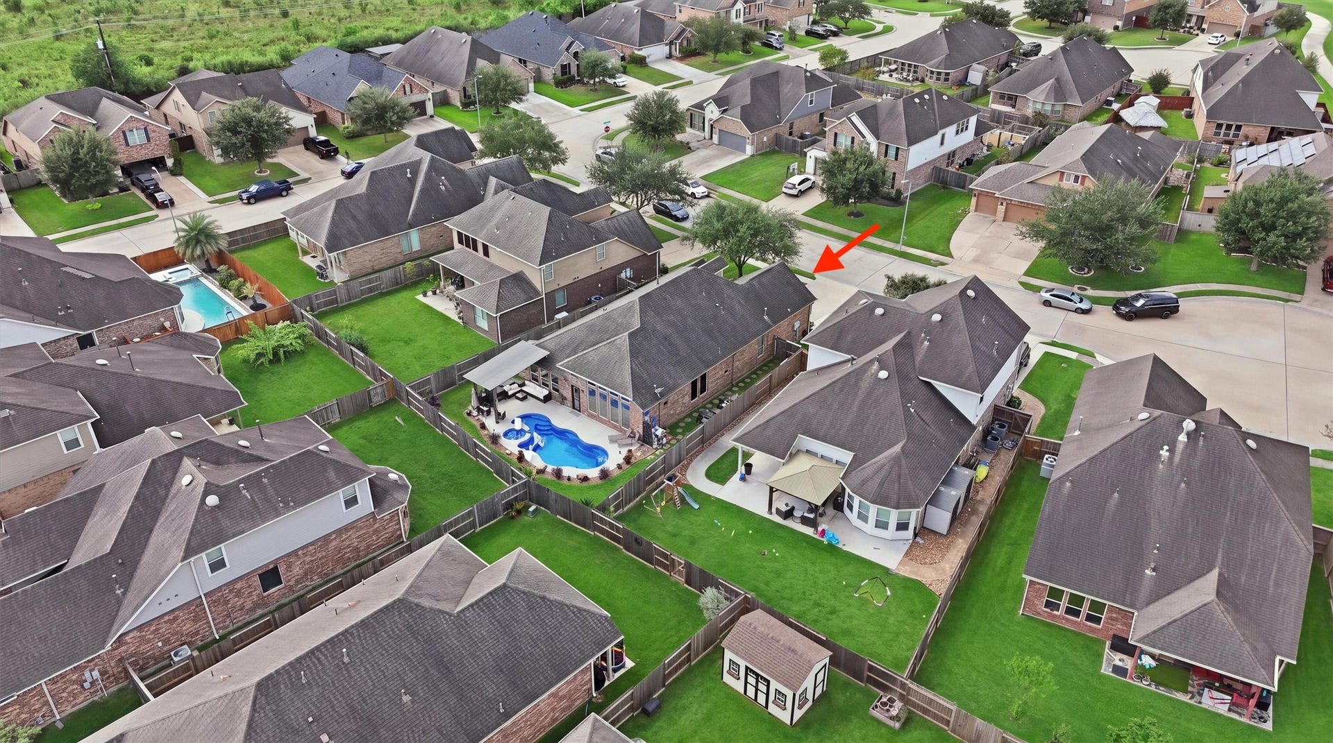 1413 Silver Rings Court, Pearland, TX 77581 Aerial view showcasing the home, backyard pool and surrounding neighborhood.
