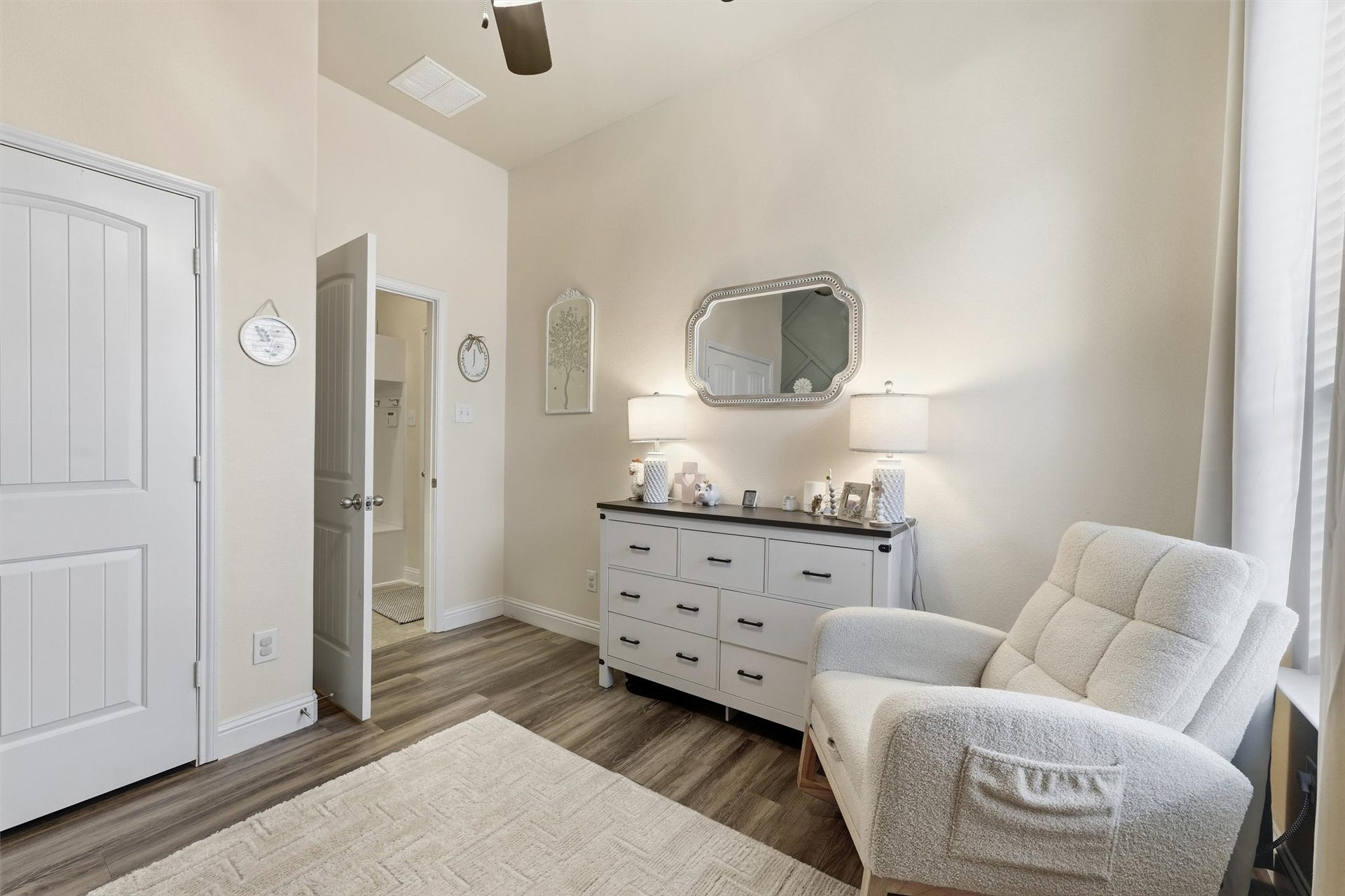 1413 Silver Rings Court, Pearland, TX 77581 Charming bedroom #4 featuring a sage green accent wall with geometric detailing complemented by natural light from a large window.