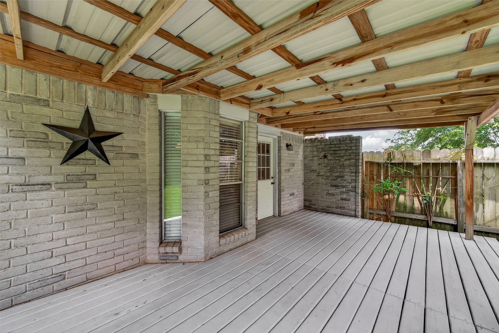 2811 Pheasant Creek Drive, Sugar Land, TX 77498 Actual view of the expansive covered deck overlooking the backyard.