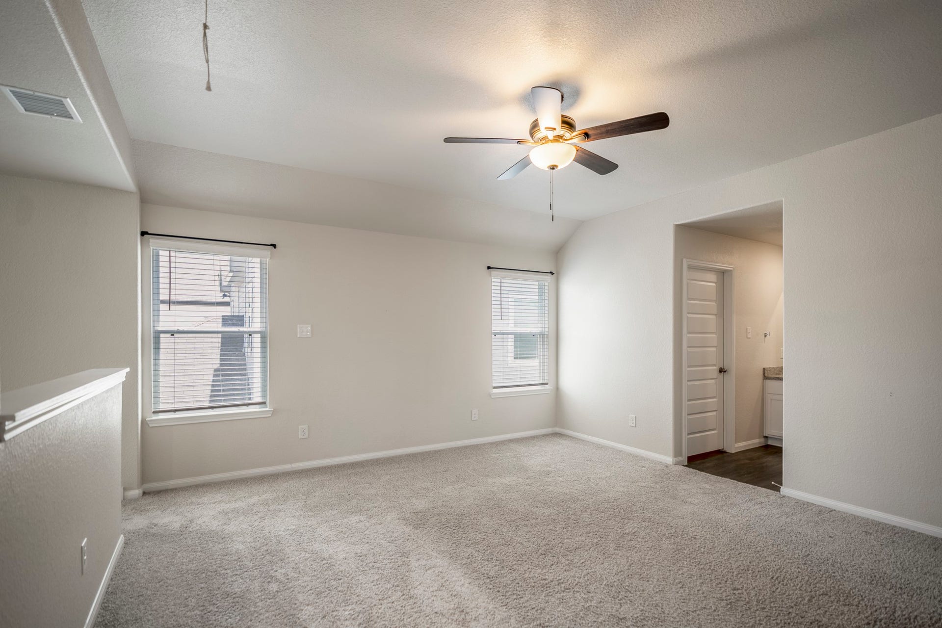 2355 Mount Locke Path, Conroe, TX 77301 Stepping back out of the upstairs bath brings you into the gameroom again, with the utility room tucked behind the door on the left.