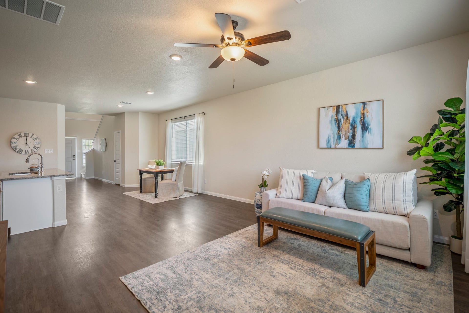 2355 Mount Locke Path, Conroe, TX 77301 Looking back from the living room, you can see how seamlessly the space connects to the dining area and kitchen beyond. The open layout keeps conversation flowing from one space to the next, while the rear windows bring natural light across the room.
