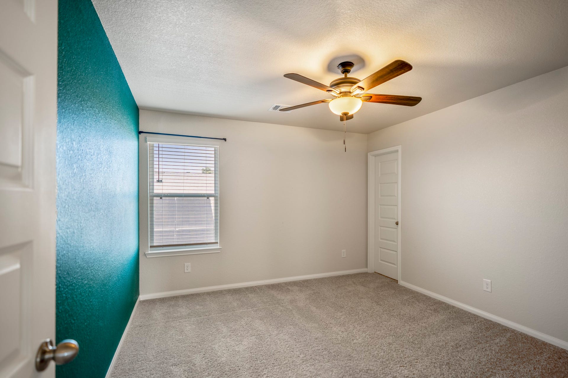2355 Mount Locke Path, Conroe, TX 77301 Stepping into the third bedroom, a window brings in natural light while the ceiling fan adds everyday comfort overhead. This room continues the generous upstairs layout, with another impressively spacious closet adding the kind of storage that really stands out throughout the home.