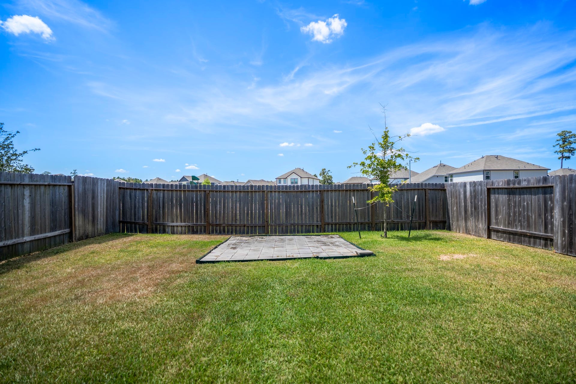 2355 Mount Locke Path, Conroe, TX 77301 Taking one more look across the backyard, the open lawn stretches toward the rear fence with no neighbors directly behind, giving the space a little more breathing room. The automatic sprinkler system helps simplify upkeep, leaving more time to enjoy the yard instead of fussing over it.
