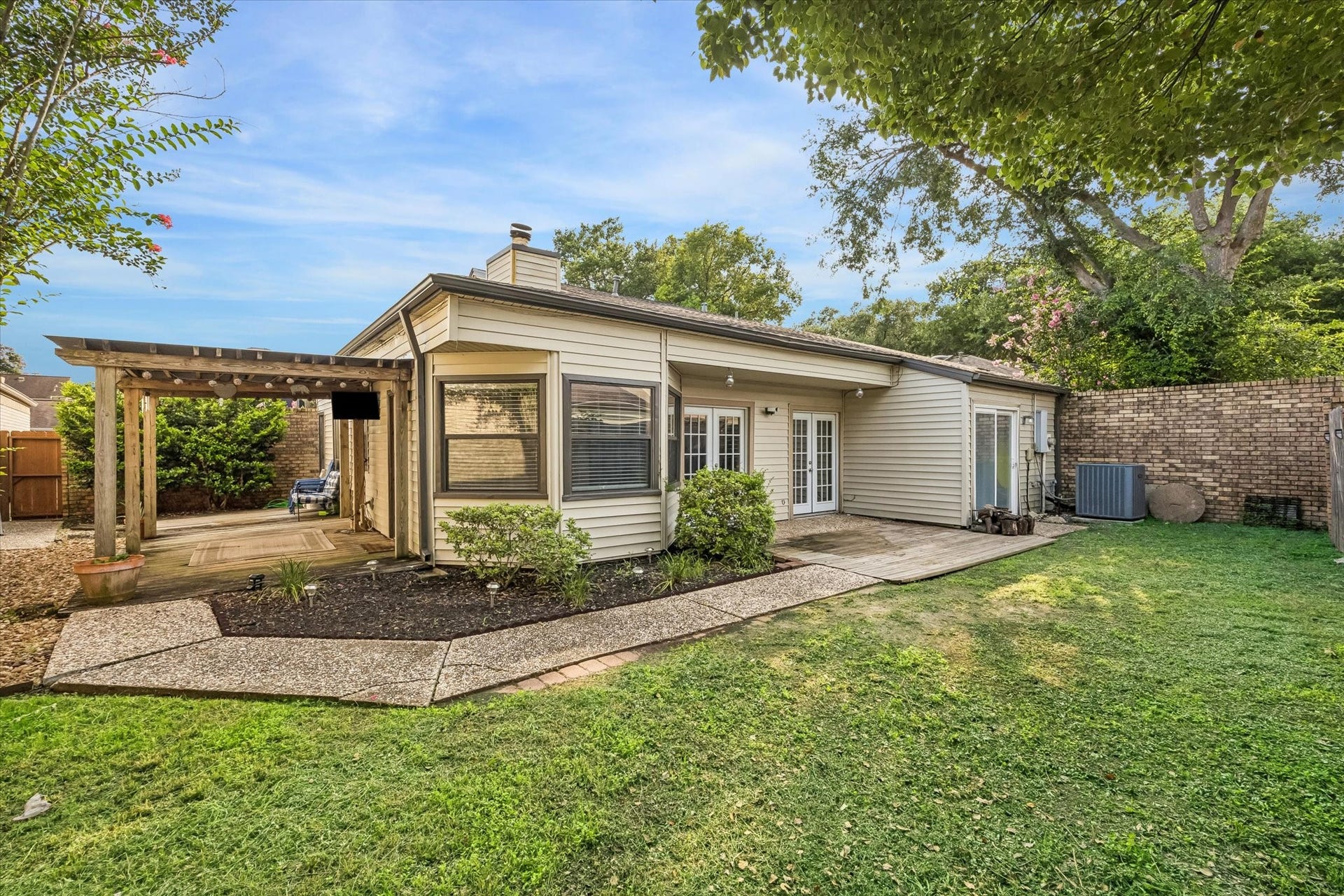 16607 Sunlight Way, Houston, TX 77058 Backyard Covered patio with TV