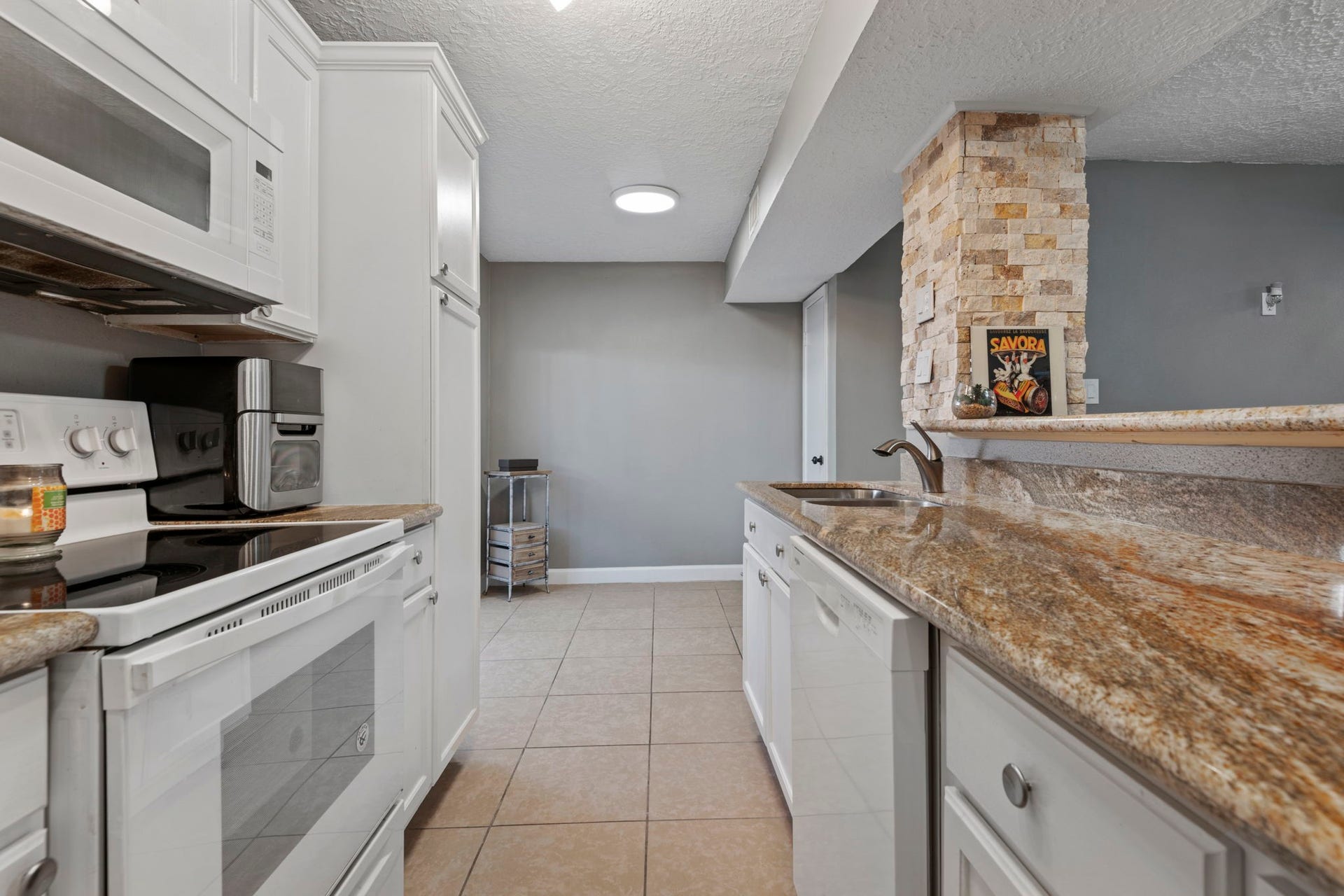 There is plenty of room beyond the kitchen for a breakfast table.