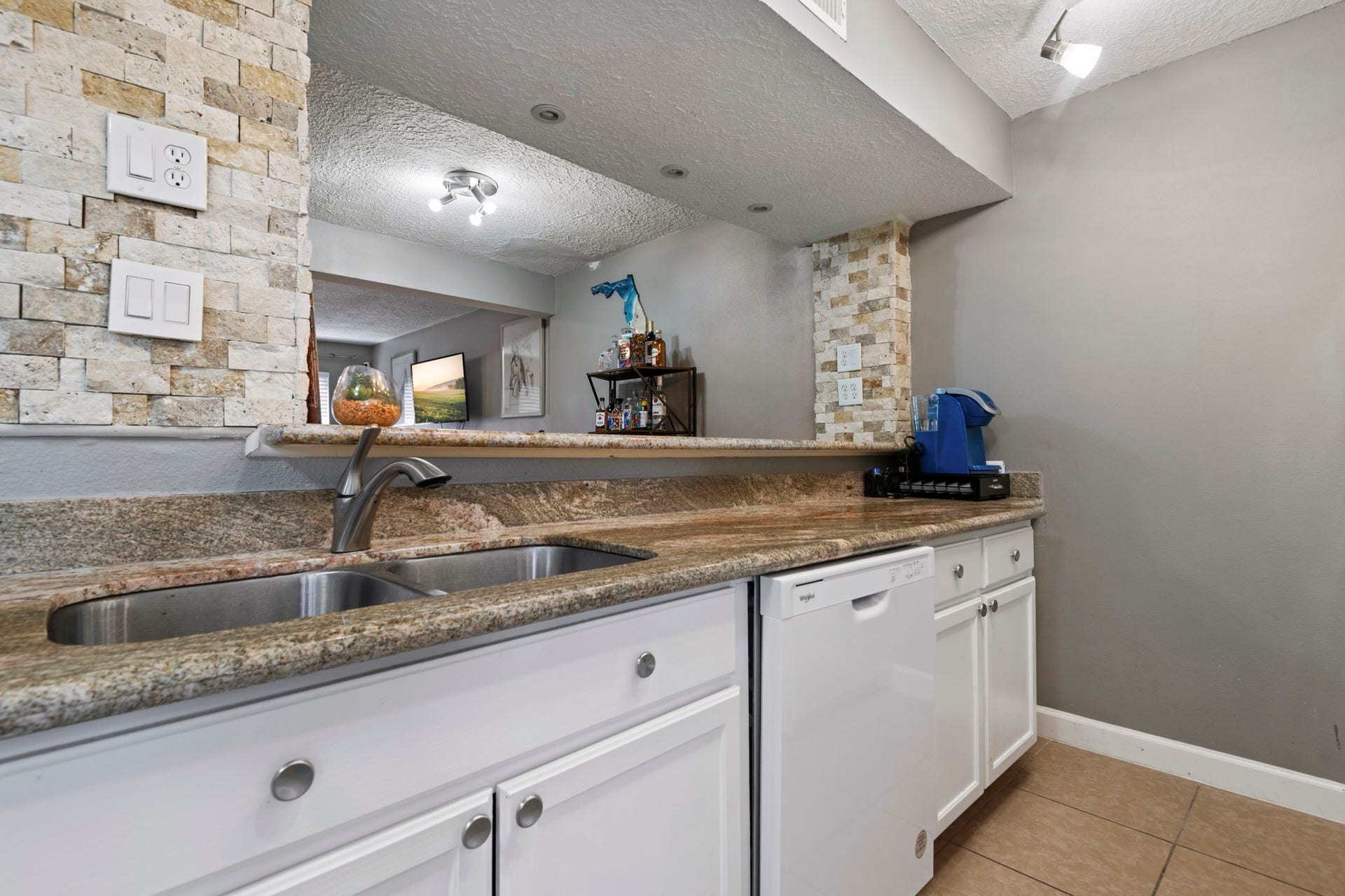 A double sink and a breakfast bar are great features of this kitchen.