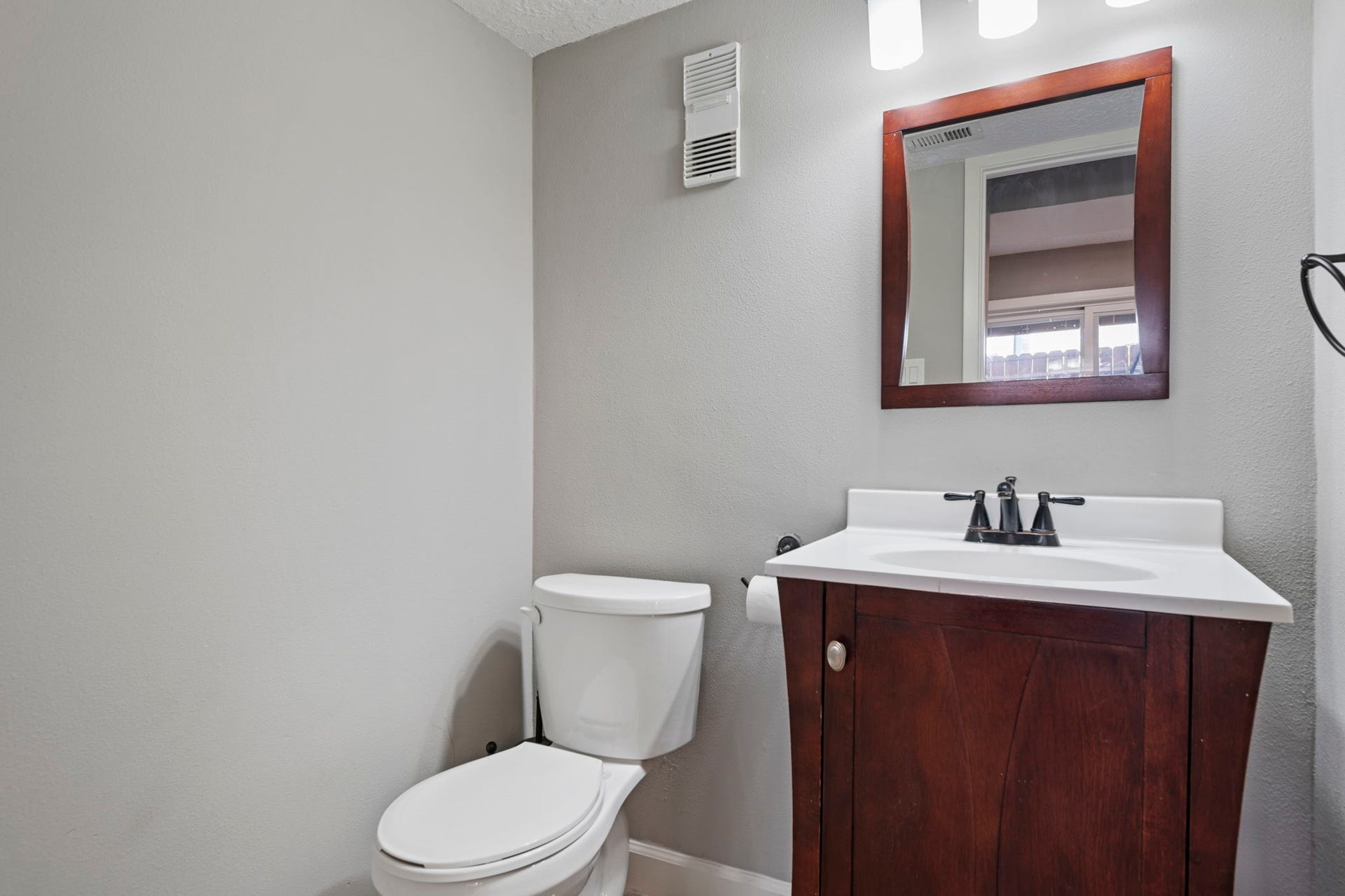 Convenient half bath located downstairs off the breakfast room.