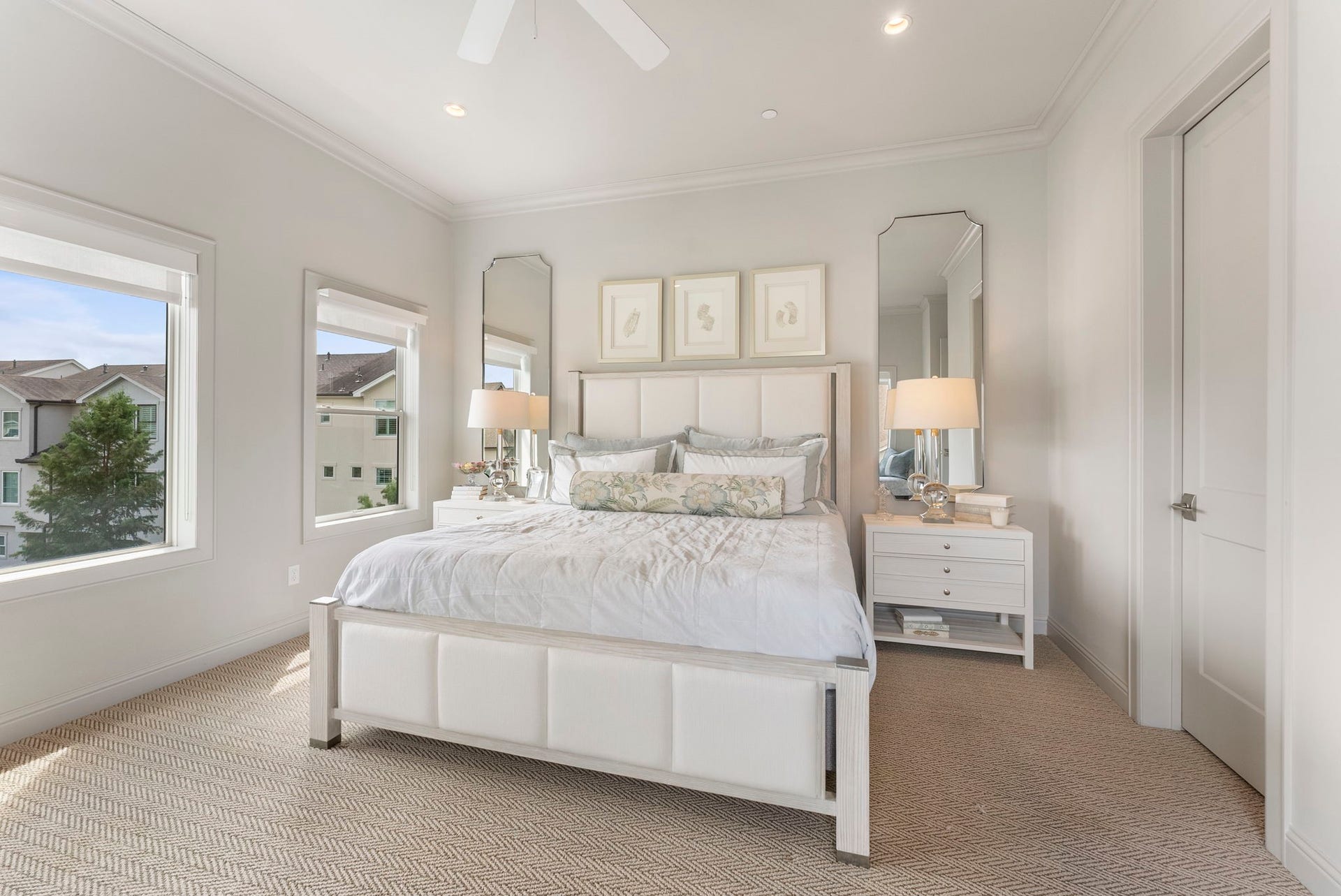 10 Nautical Terrace Way, The Woodlands, TX 77380 Peaceful fourth-floor guest retreat with dual windows, soft herringbone-weave carpet, ceiling fan and recessed lighting, offering visitors or family members comfort and privacy.