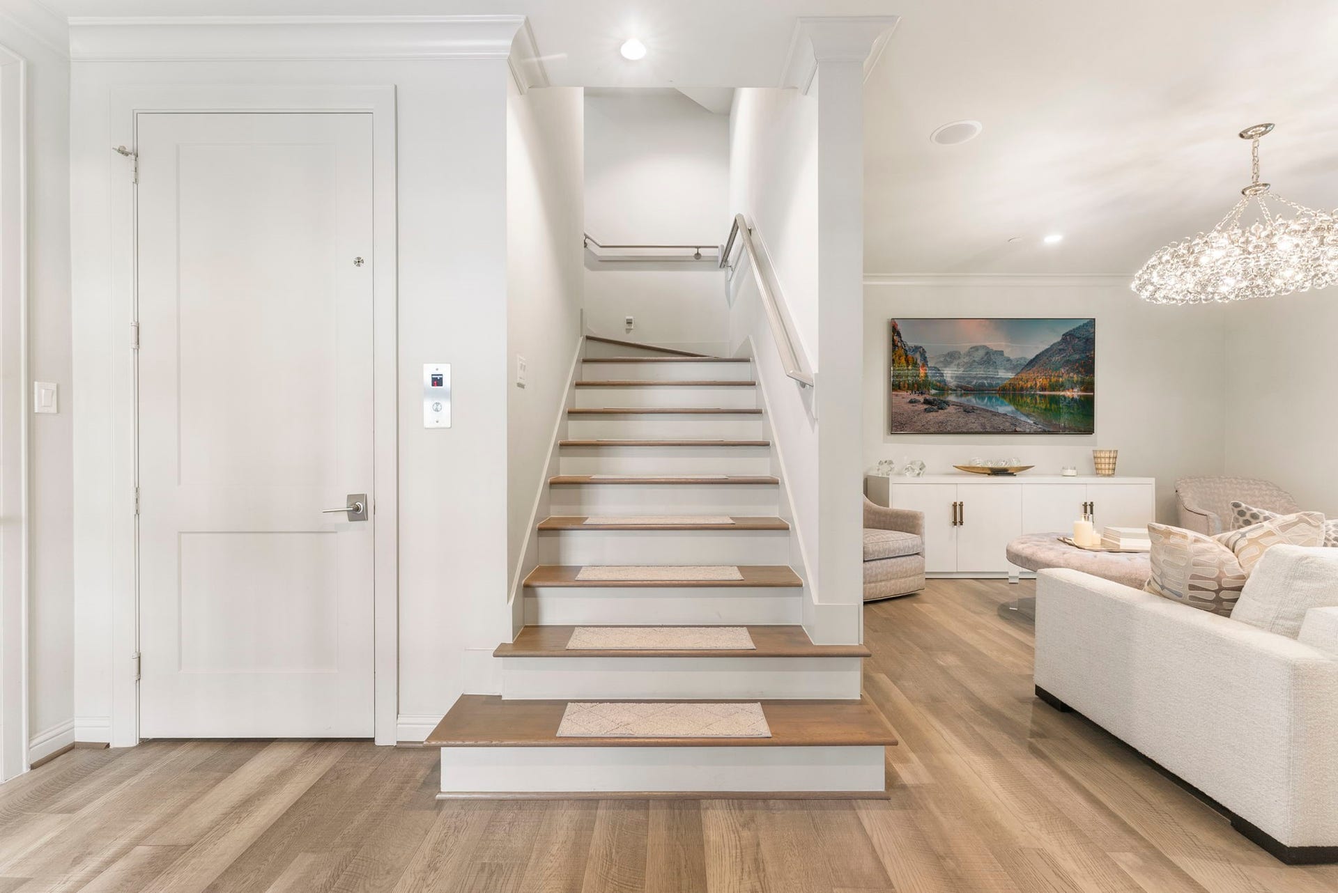 10 Nautical Terrace Way, The Woodlands, TX 77380 Elevator and staircase converge on the first floor, offering easy access to every level for guests, groceries and aging-in-place comfort.