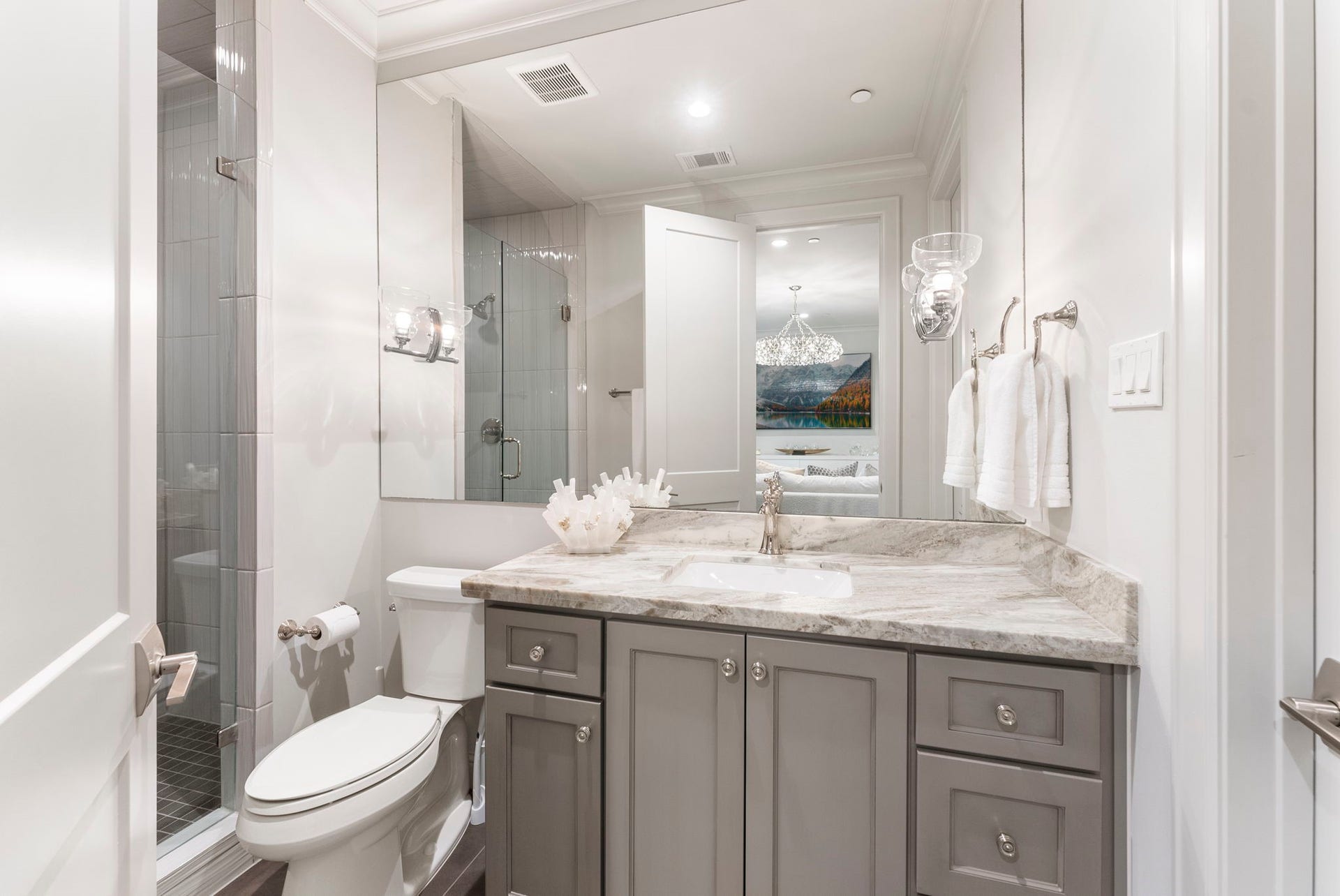 10 Nautical Terrace Way, The Woodlands, TX 77380 Private full bath with full walk in closet serving the flex suite, with stone vanity and walk-in glass shower, giving visiting family or guests their own retreat.