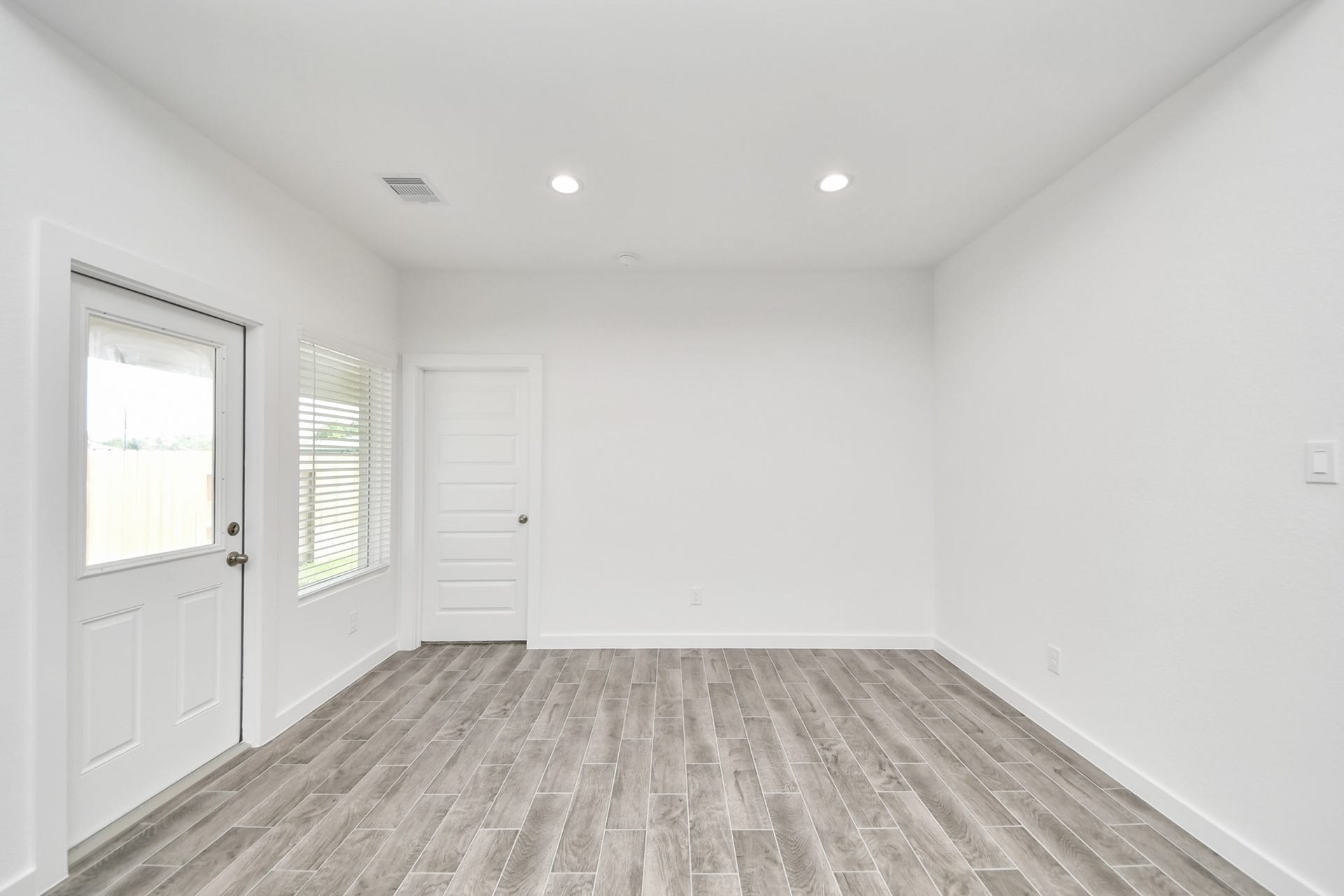 Make memories gathered around the table with your family and friends! This spacious dining room features elegant flooring, custom paint, and adjacent to family room and kitchen for open concept feel. Sample photo of completed home with similar floor plan. Actual colors and selections may vary.