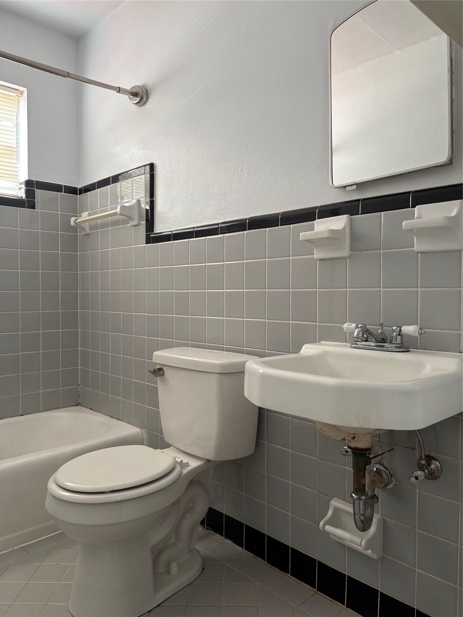 1915 Branard Street, #10, Houston, TX 77098 Neutral tone bathroom with tiled floor