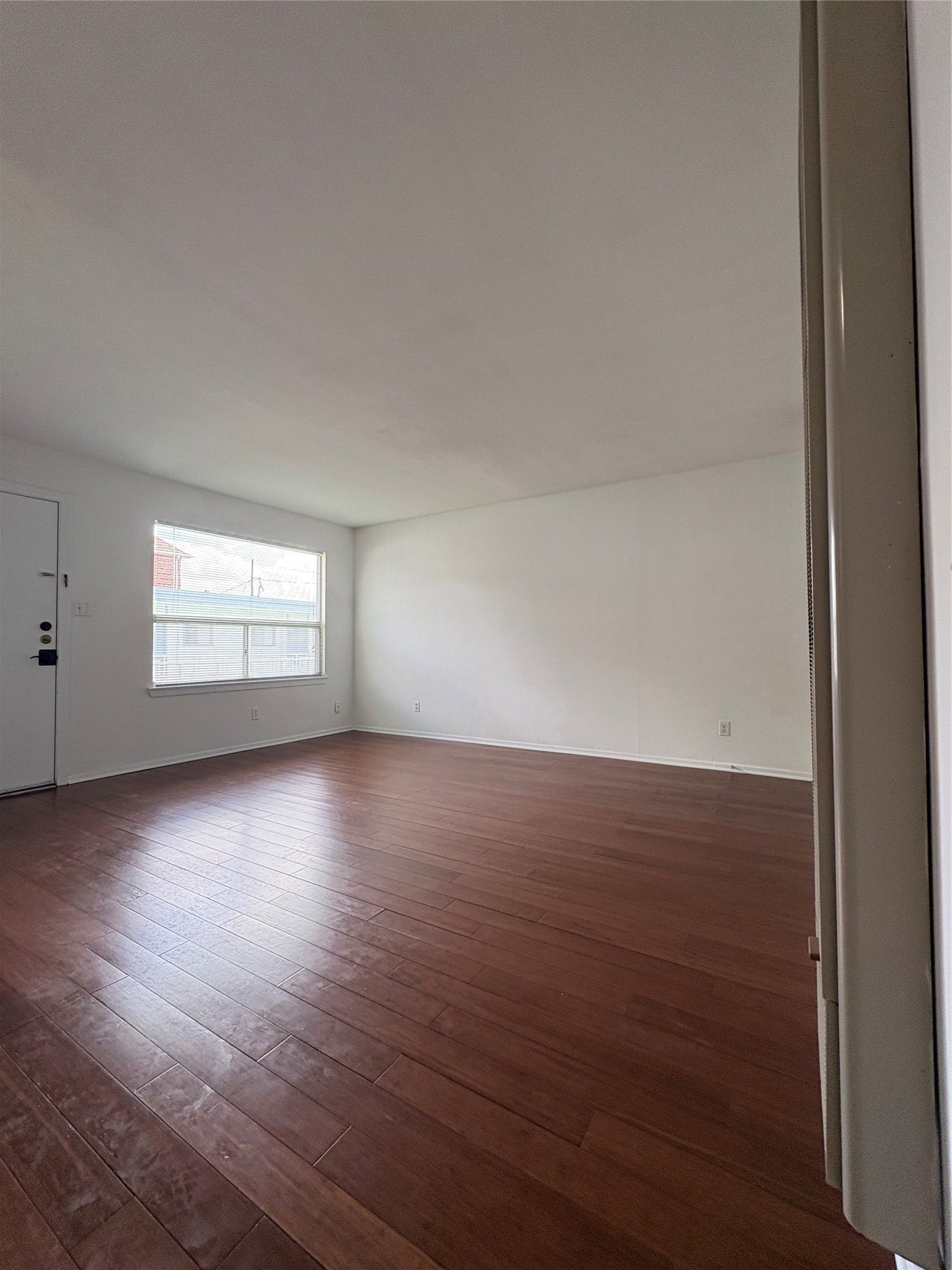 1915 Branard Street, #10, Houston, TX 77098 Large livingroom space with beautiful neutral engineered wood floors.