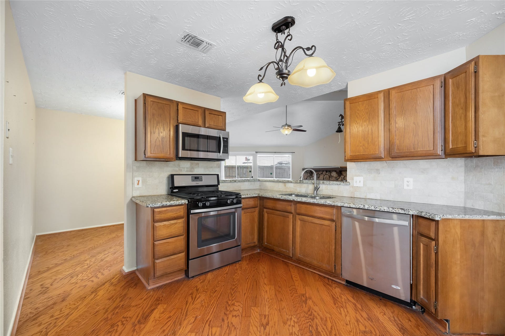 Kitchen showing granite counter tops