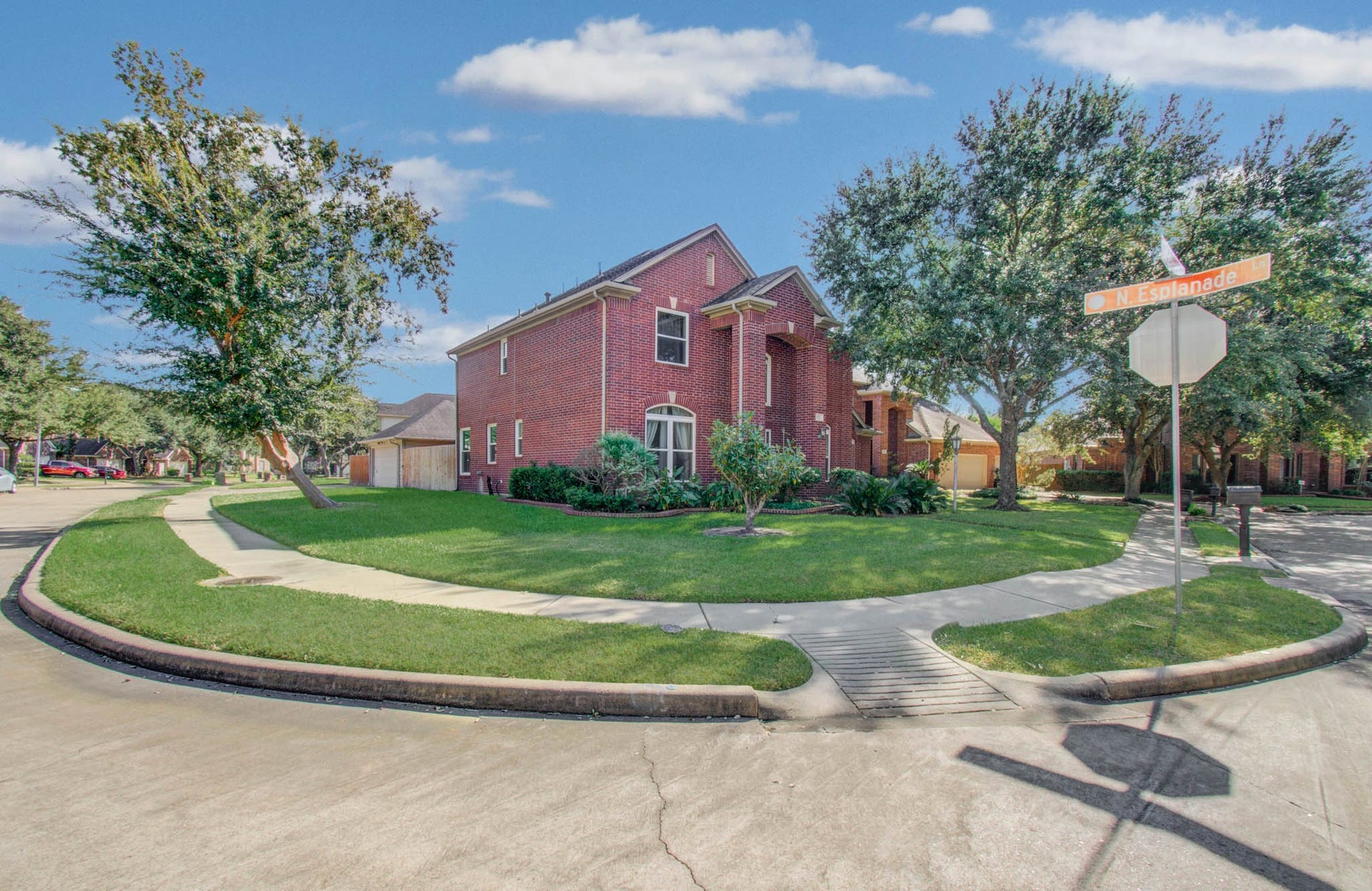 The house sits promininetly on this corner lot