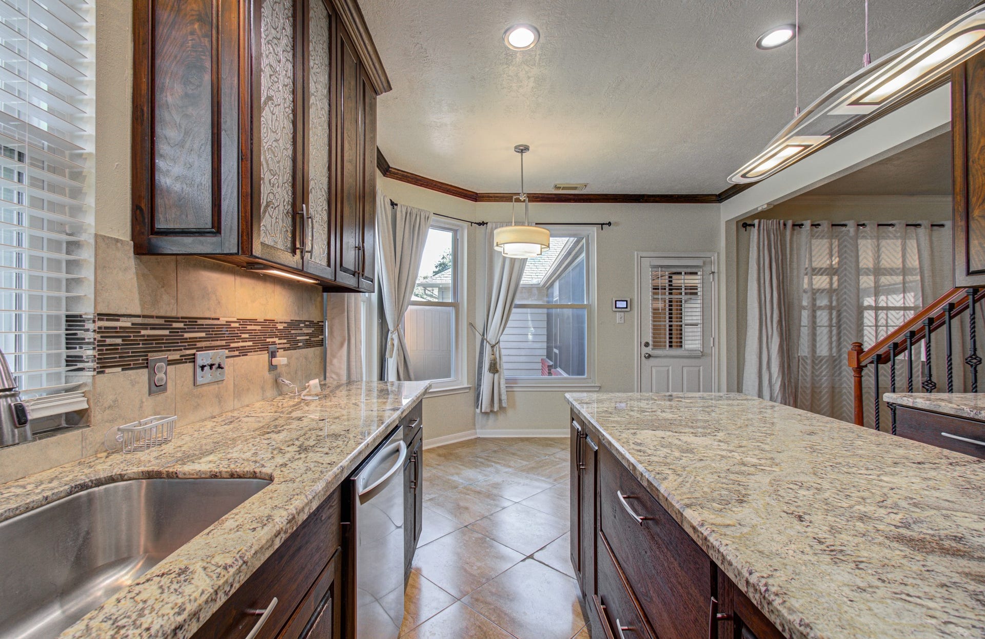 The kitchen leads into a generous breakfast room