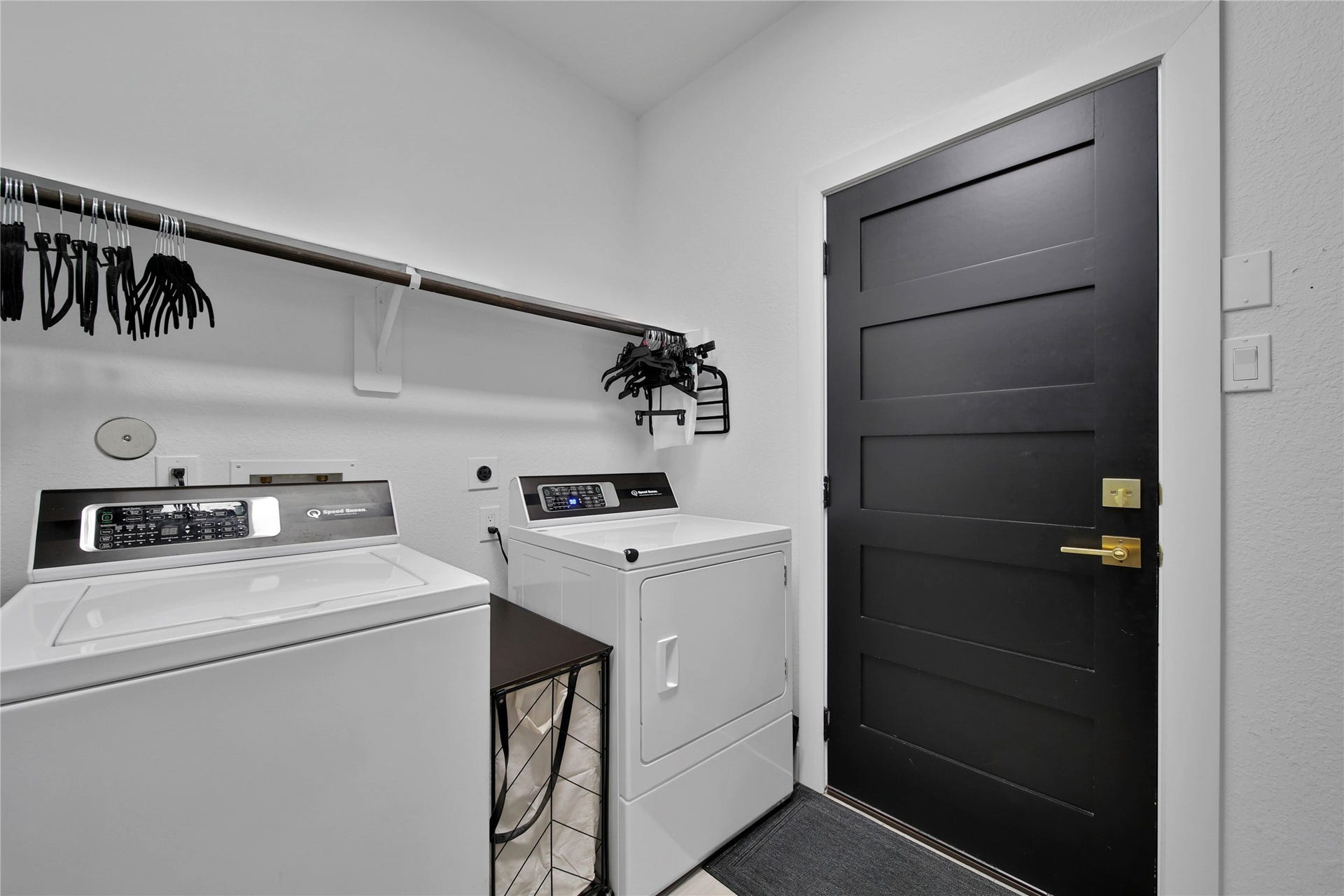 142 Pronghorn Place, Montgomery, TX 77316 Laundry room has shelving and access to water manifold. Conveniently located accross from primary bedroom. Garage access through laundry room and also hallway to bypass it.