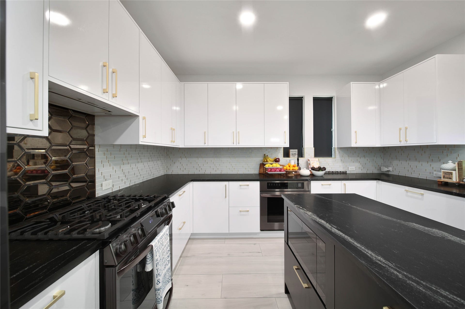 142 Pronghorn Place, Montgomery, TX 77316 Custom cabinetry that includes an extra shelf in all uppers, drawers for all lowers, hidden drawers within drawers below countertops, 2 ovens (1 gas, 1 electric), oversized farm-house / workstation sink, GAS range.