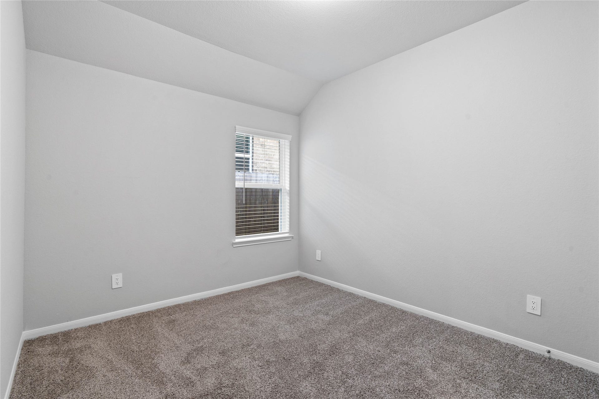 19560 Stripe Hill Bend, Montgomery, TX 77316 This cozy secondary bedroom offers plush soft carpeting, neutral walls ready for personalization, a sun-filled window with fitted blinds, sloped ceilings, and a spacious closet for all your storage needs.