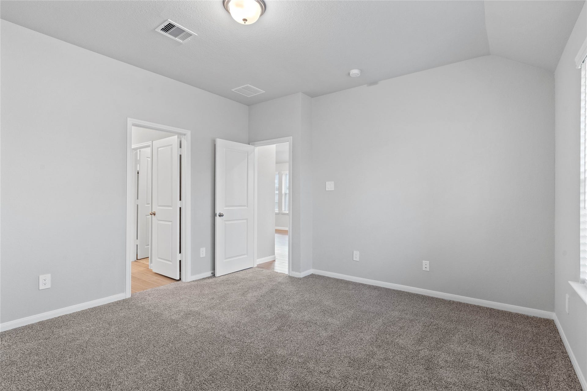 19560 Stripe Hill Bend, Montgomery, TX 77316 The private primary suite efficiently connects the sleeping area with the dedicated bathroom and generous closet.