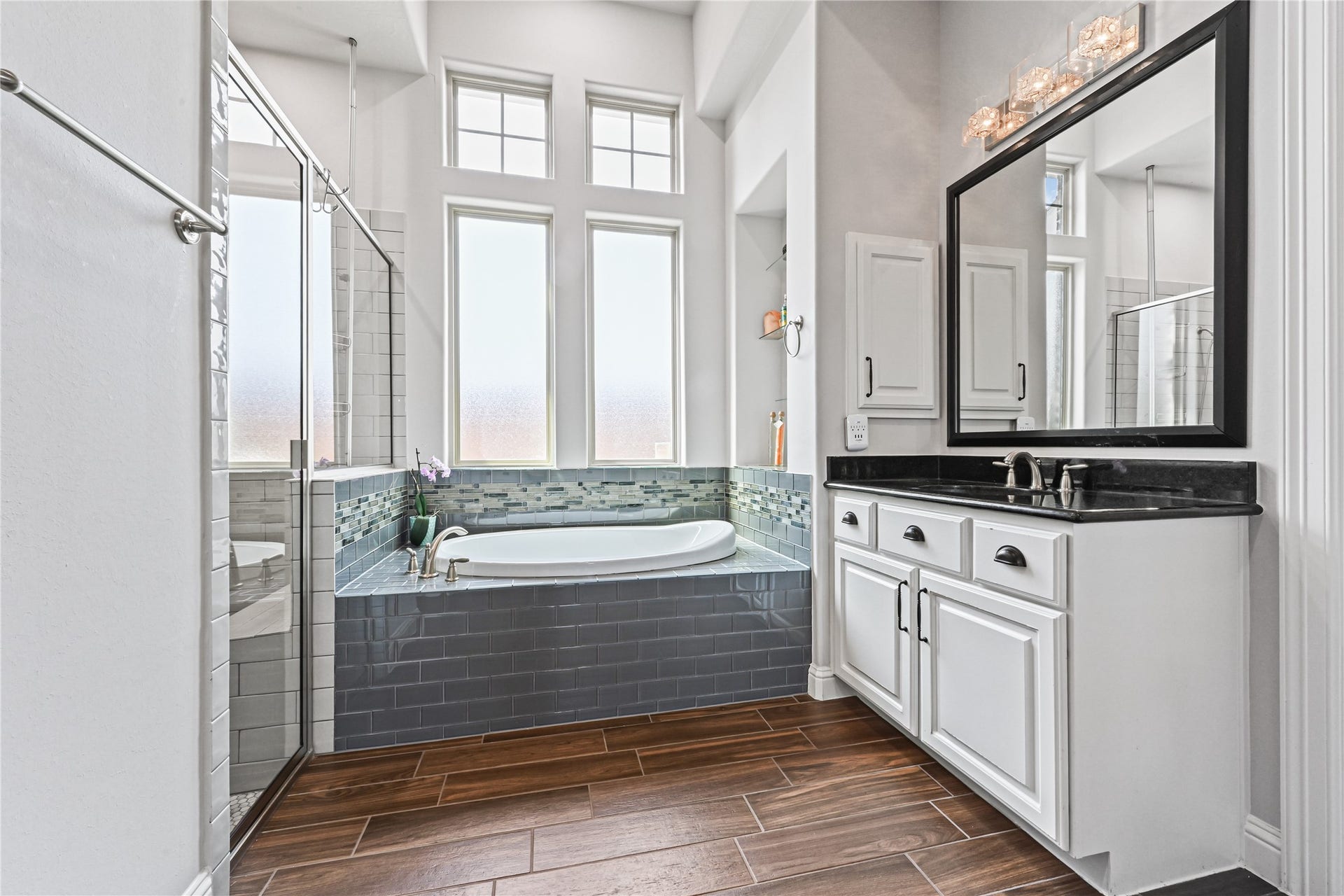 This spa-inspired bathroom also features his own private vanity with gorgeous granite countertops, deep undermount sink, framed mirror & medicine cabinet! And then theres that fabulous deep soaker tubWOW, WOW! The perfect place to relax, unwind & soak away the day in your own luxurious private retreat!