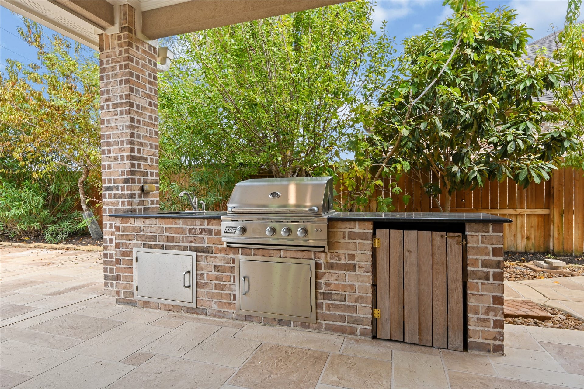 Step outside and discover your incredible outdoor retreat! The custom outdoor kitchen features gorgeous granite countertops, a deep undermount sink, built-in stainless steel grill & more. Perfect for weekend cookouts, entertaining family and friends or simply relaxing by the poolthis backyard was made for enjoying the good life!