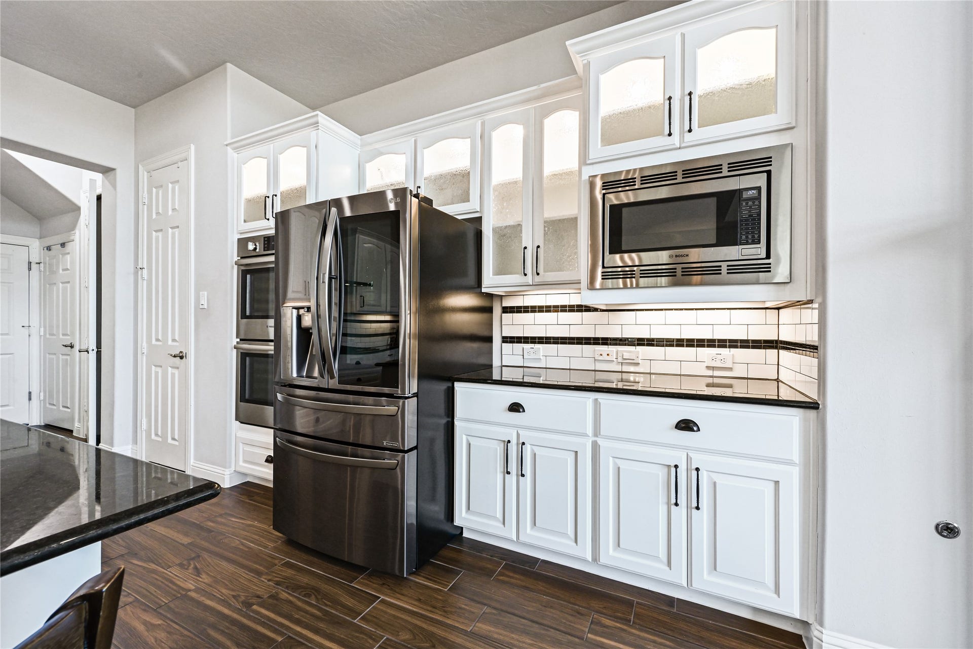This gourmet kitchen truly has it all! Beautiful custom cabinetry is enhanced with stunning interior accent lighting in the upper cabinets plus under-cabinet lighting that adds warmth, style & the perfect finishing touch. Custom details everywhere you lookthis kitchen was designed to impress!