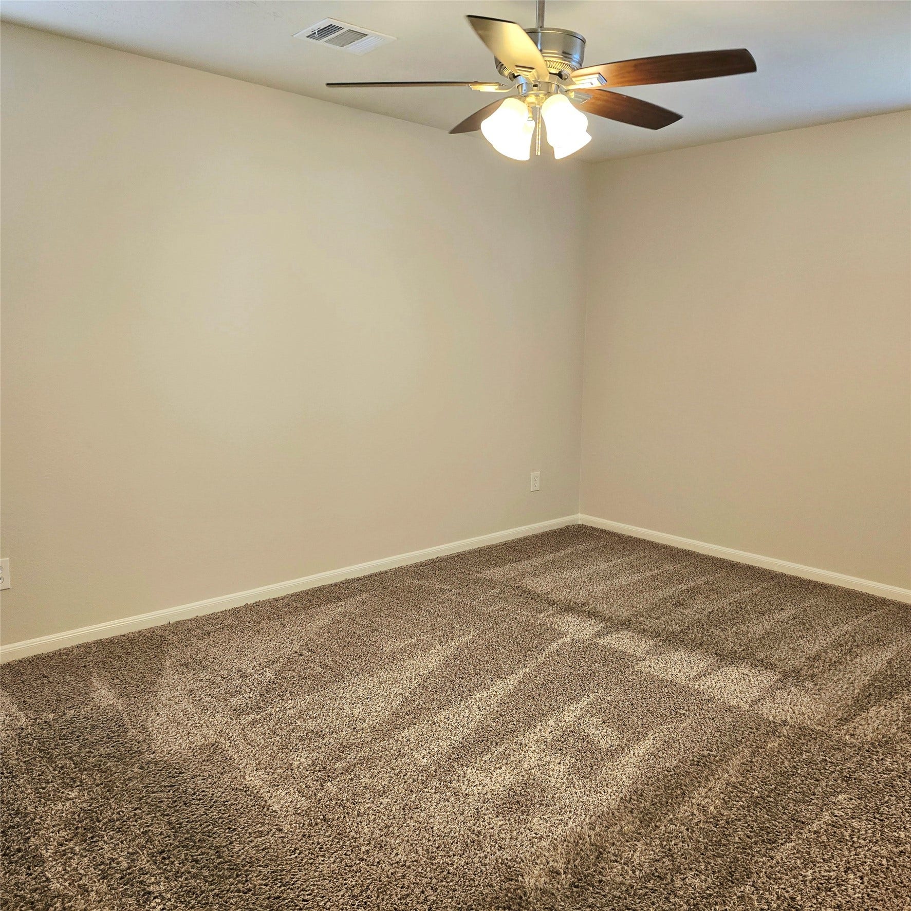 12006 Audubon Hill Court, Houston, TX 77038 2nd bedroom upstairs. Ceiling fan with light fixtures.