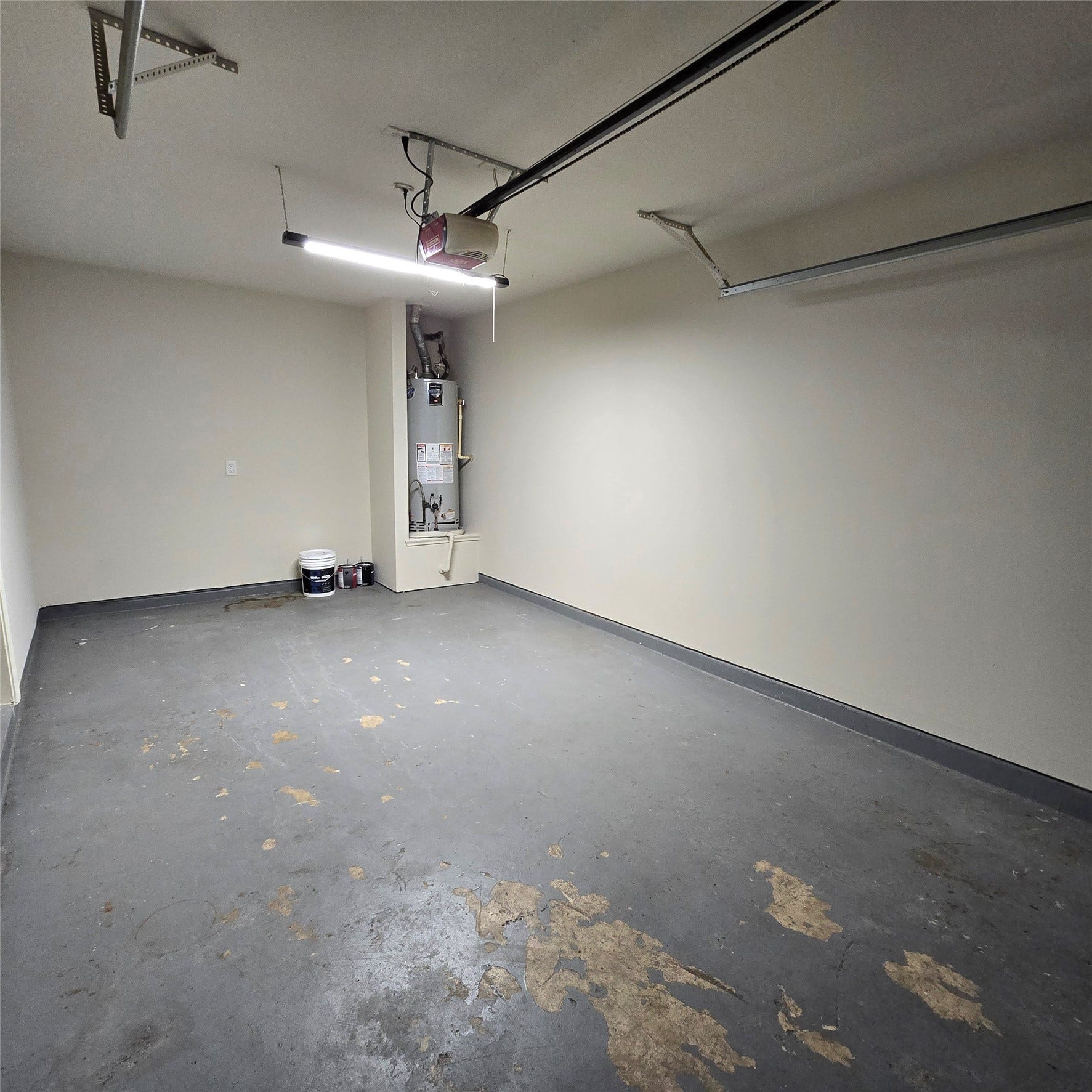 12006 Audubon Hill Court, Houston, TX 77038 Garage with extra lighting, auto opener. Water heater.