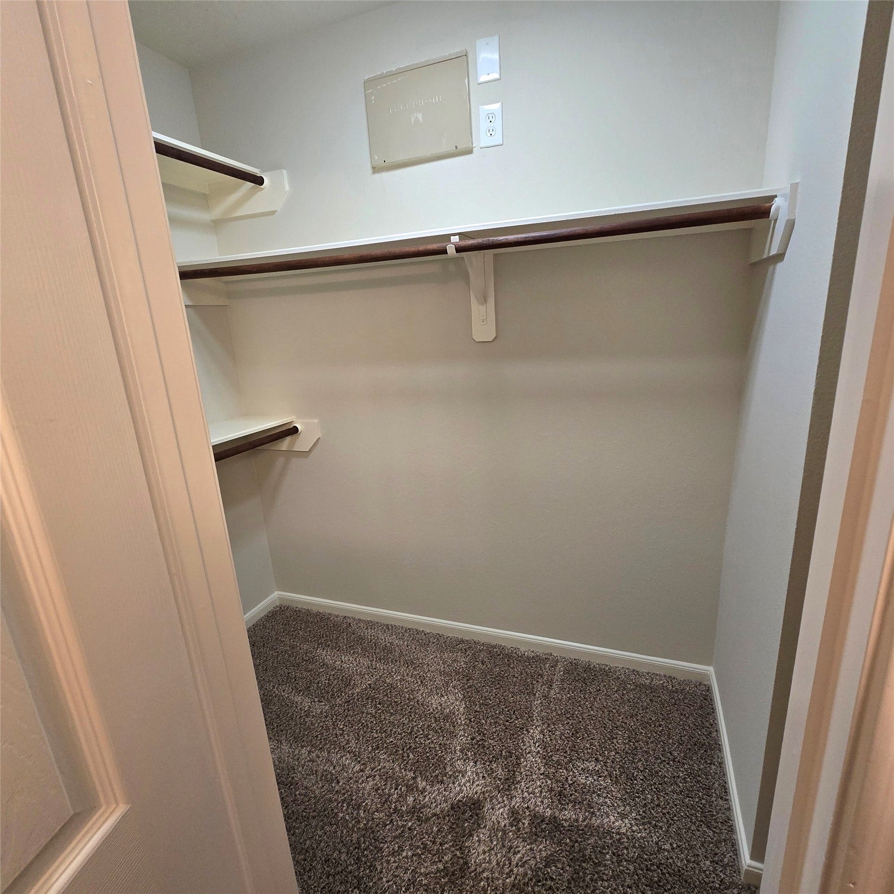 12006 Audubon Hill Court, Houston, TX 77038 Large primary walk-in closet. Shelves and convenient rods.