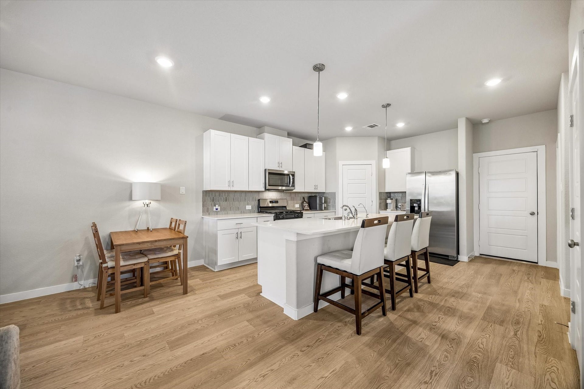 14838 Silent Gulf Avenue, Houston, TX 77082 A wider perspective showcases the kitchen and its connection to the surrounding living spaces, creating an inviting atmosphere for daily activities and entertaining.