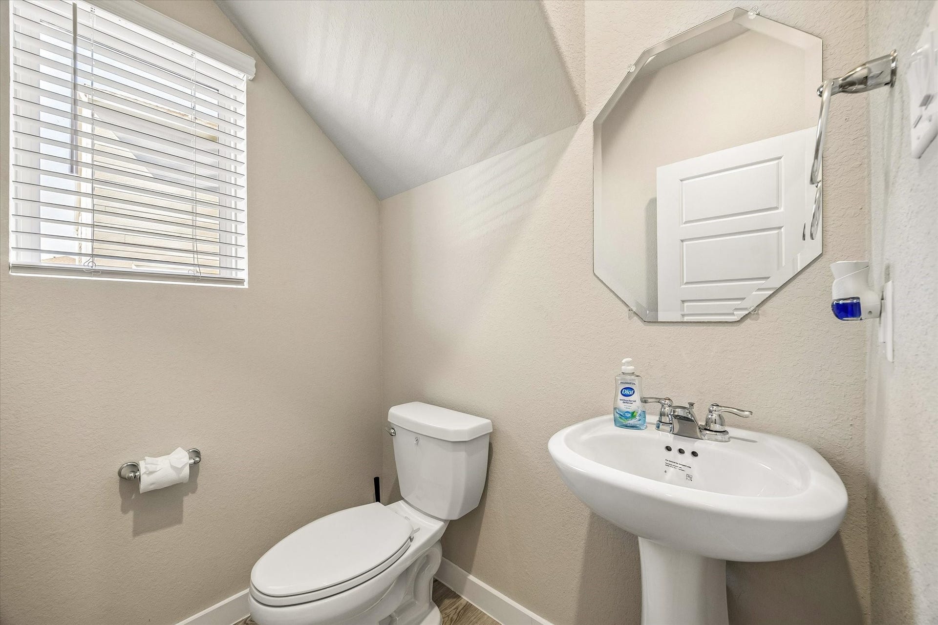 14838 Silent Gulf Avenue, Houston, TX 77082 Conveniently located powder room provides an added level of functionality for guests while keeping the home's private bathrooms separate.