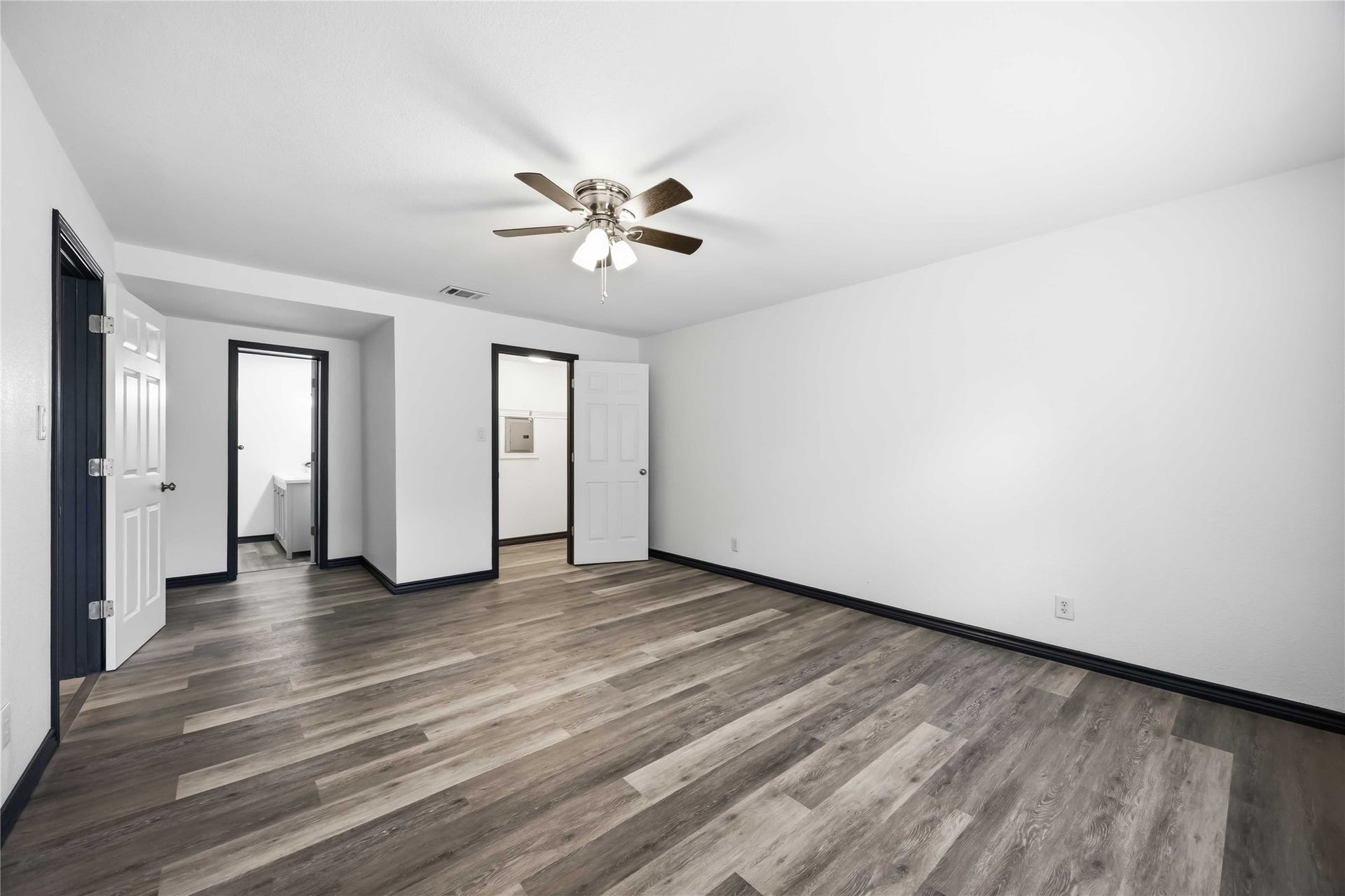 9723 Oldcrest Drive, Stafford, TX 77477 In this converted garage, a full bathroom and a walk-in closet.