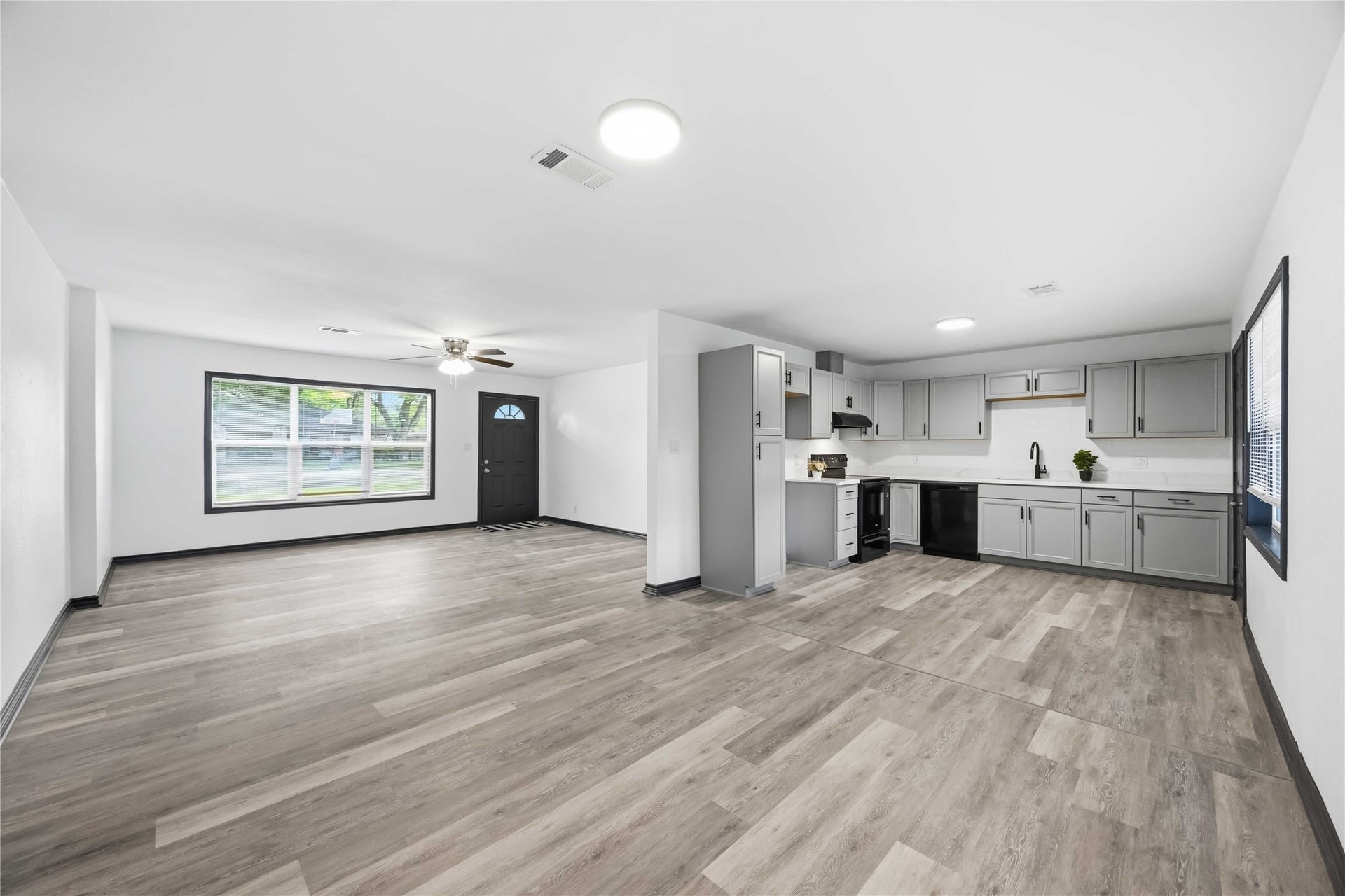 9723 Oldcrest Drive, Stafford, TX 77477 Reverse view of this remodeled kitchen with a neutral color palette.