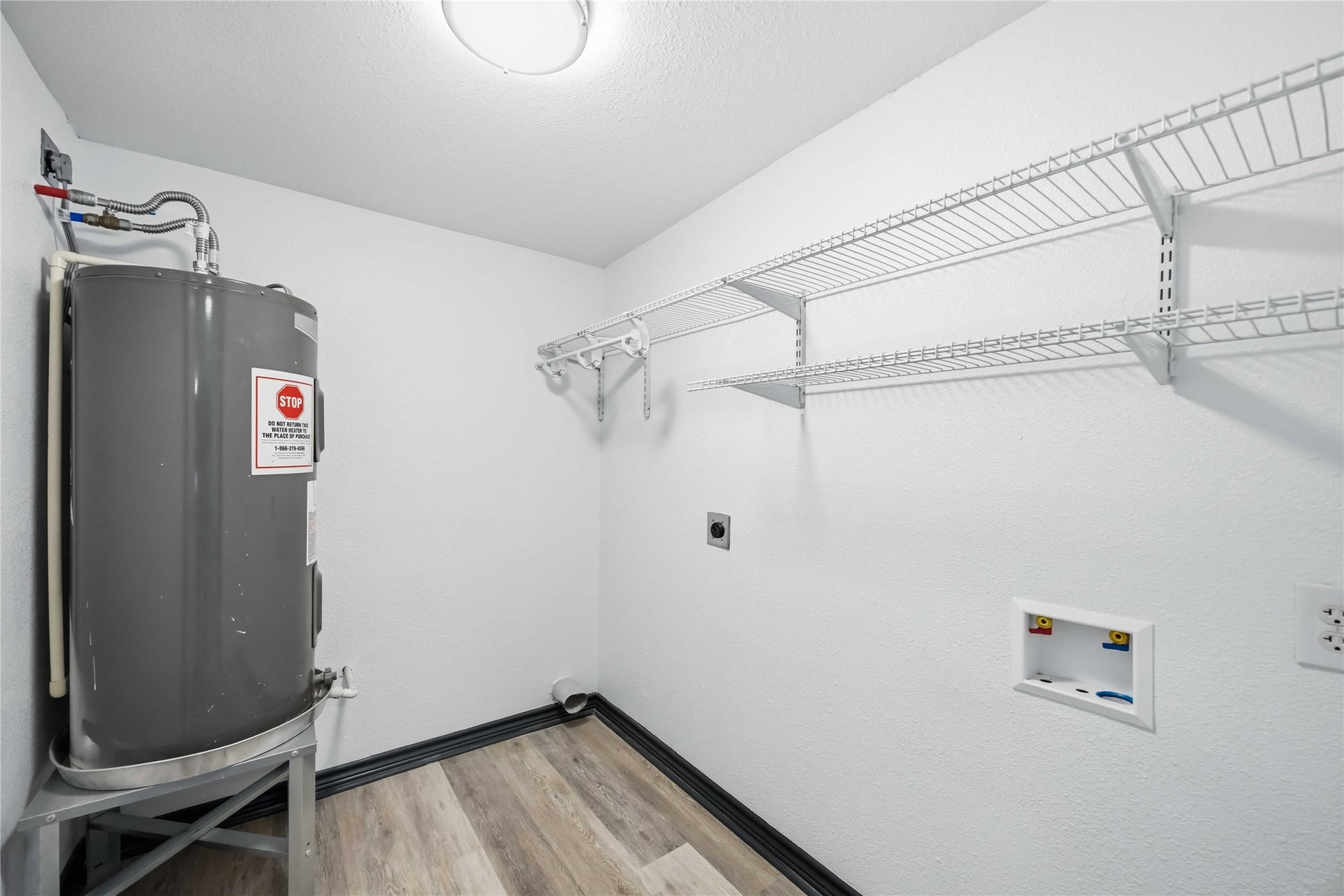 9723 Oldcrest Drive, Stafford, TX 77477 Utility room with plenty of storage.