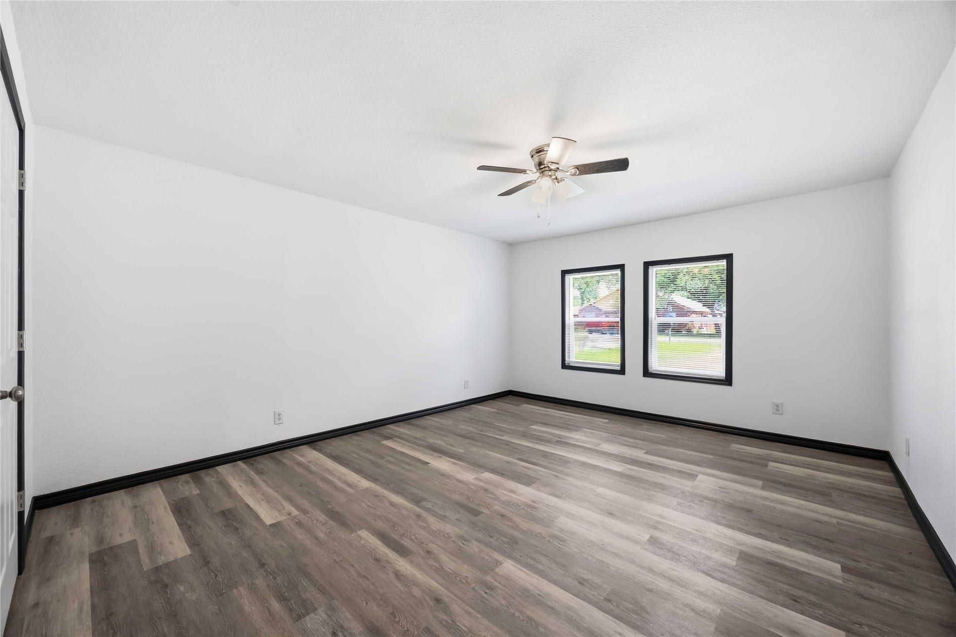 9723 Oldcrest Drive, Stafford, TX 77477 Converted garage that is now a bedroom with views of the front yard.