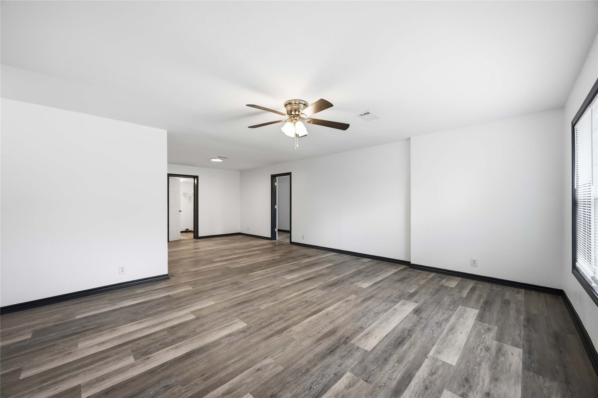 9723 Oldcrest Drive, Stafford, TX 77477 Opene door in the middle leads to the converted garage that is now a bedroom.