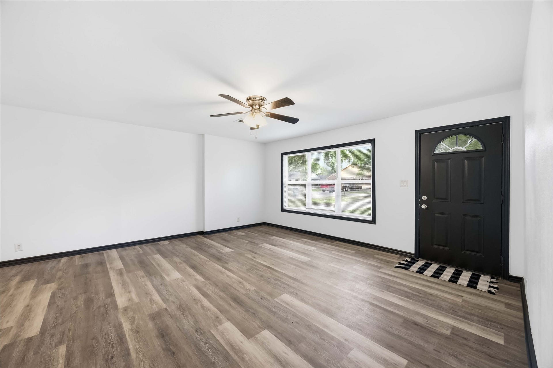 9723 Oldcrest Drive, Stafford, TX 77477 Large living room window for ample natural light.