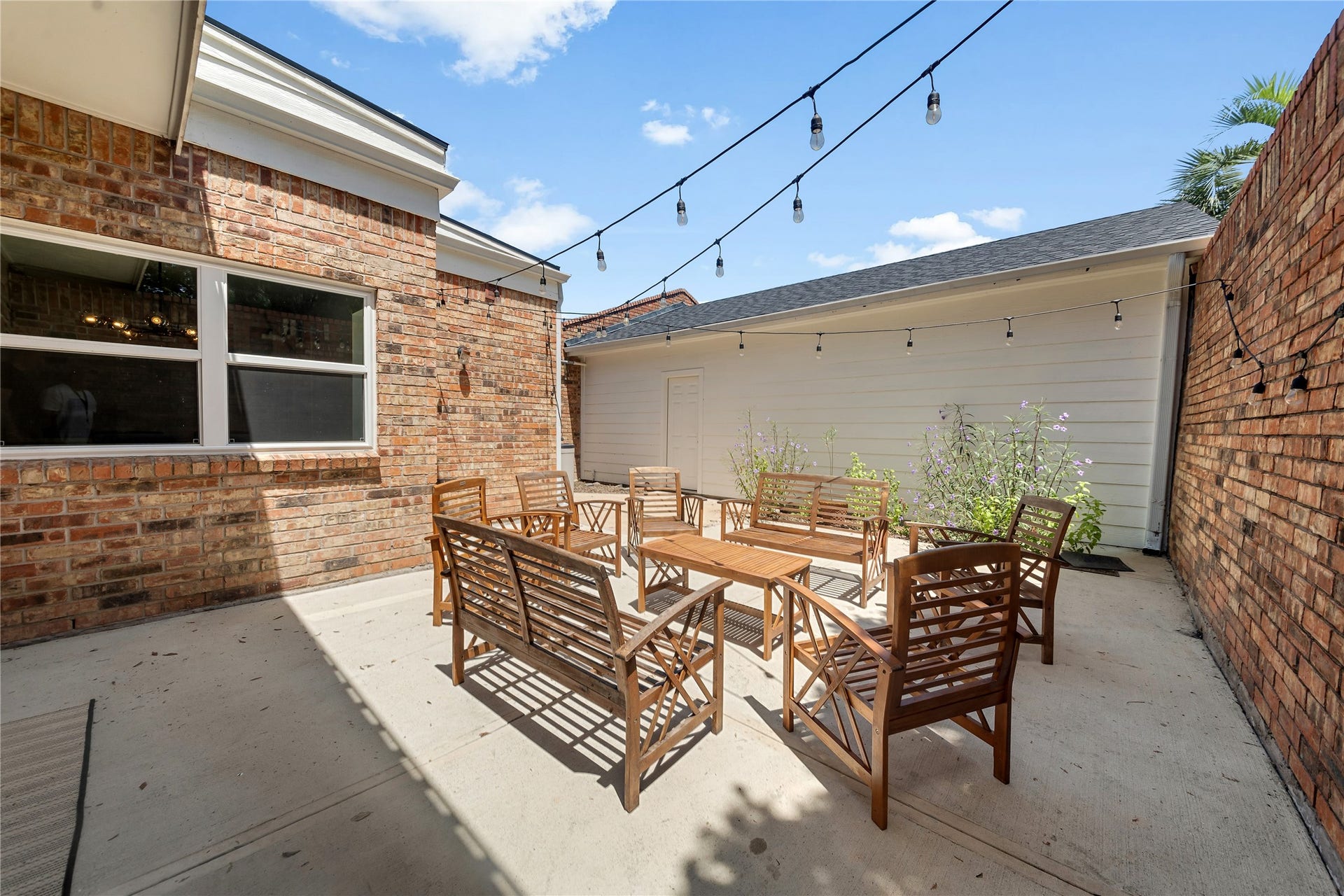 444 E Fair Harbor Lane, Houston, TX 77079 Step outside to enjoy two private patios and a balcony, where you can sip your morning coffee, unwind in the evening, or simply enjoy the peaceful surroundings beneath mature trees.