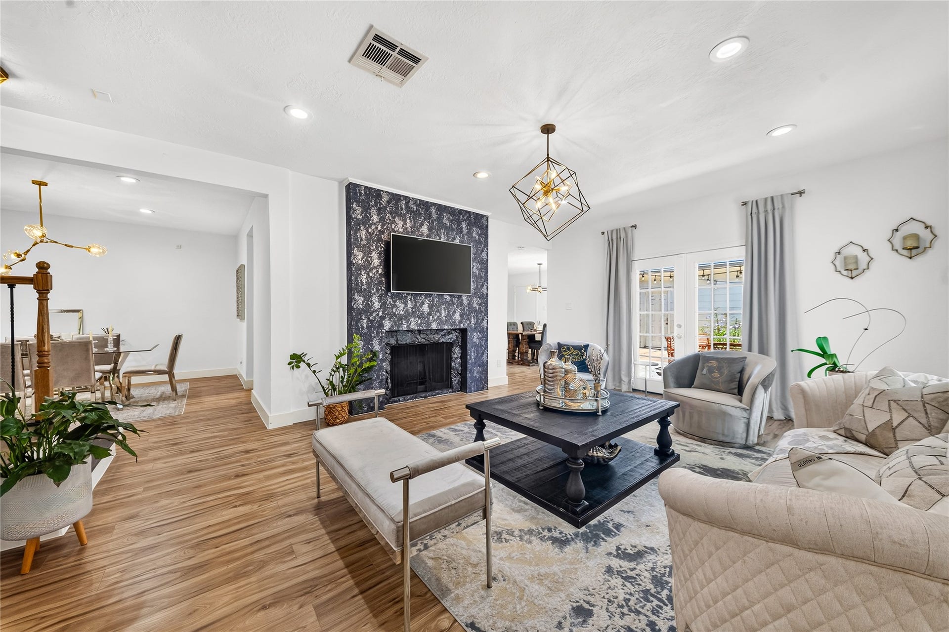 444 E Fair Harbor Lane, Houston, TX 77079 The generous formal living room invites you to relax or host a party by the fireplace