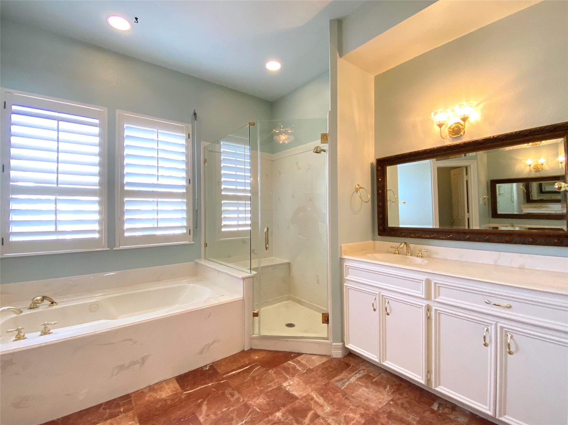 919 Long Reach Drive, Tiki Island, TX 77554 Luxurious primary ensuite with another sink and vanity on opposite side.